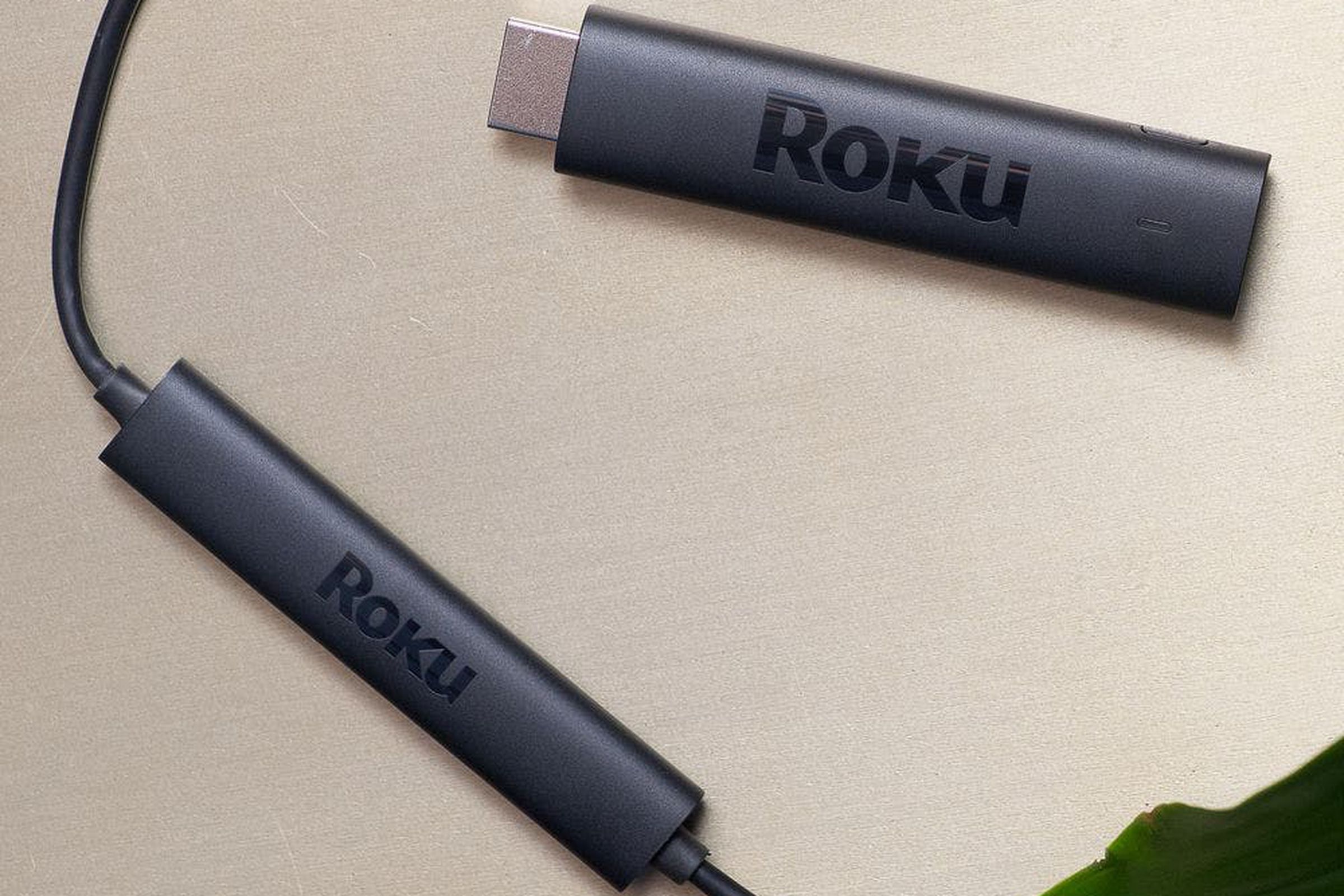 Roku’s Streaming Stick 4K lying on a table.