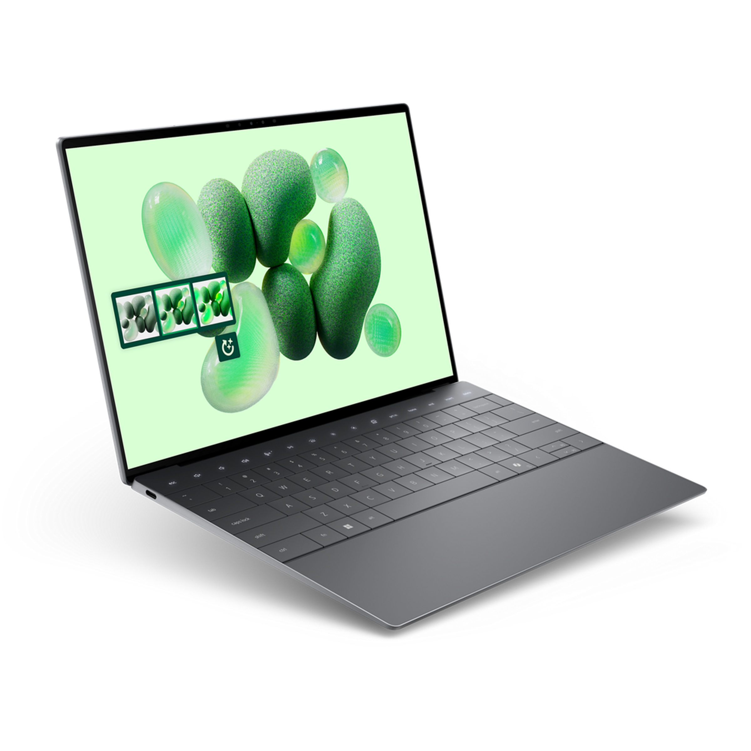 An open and powered-on laptop showing a bright green background with jellybean-like shapes