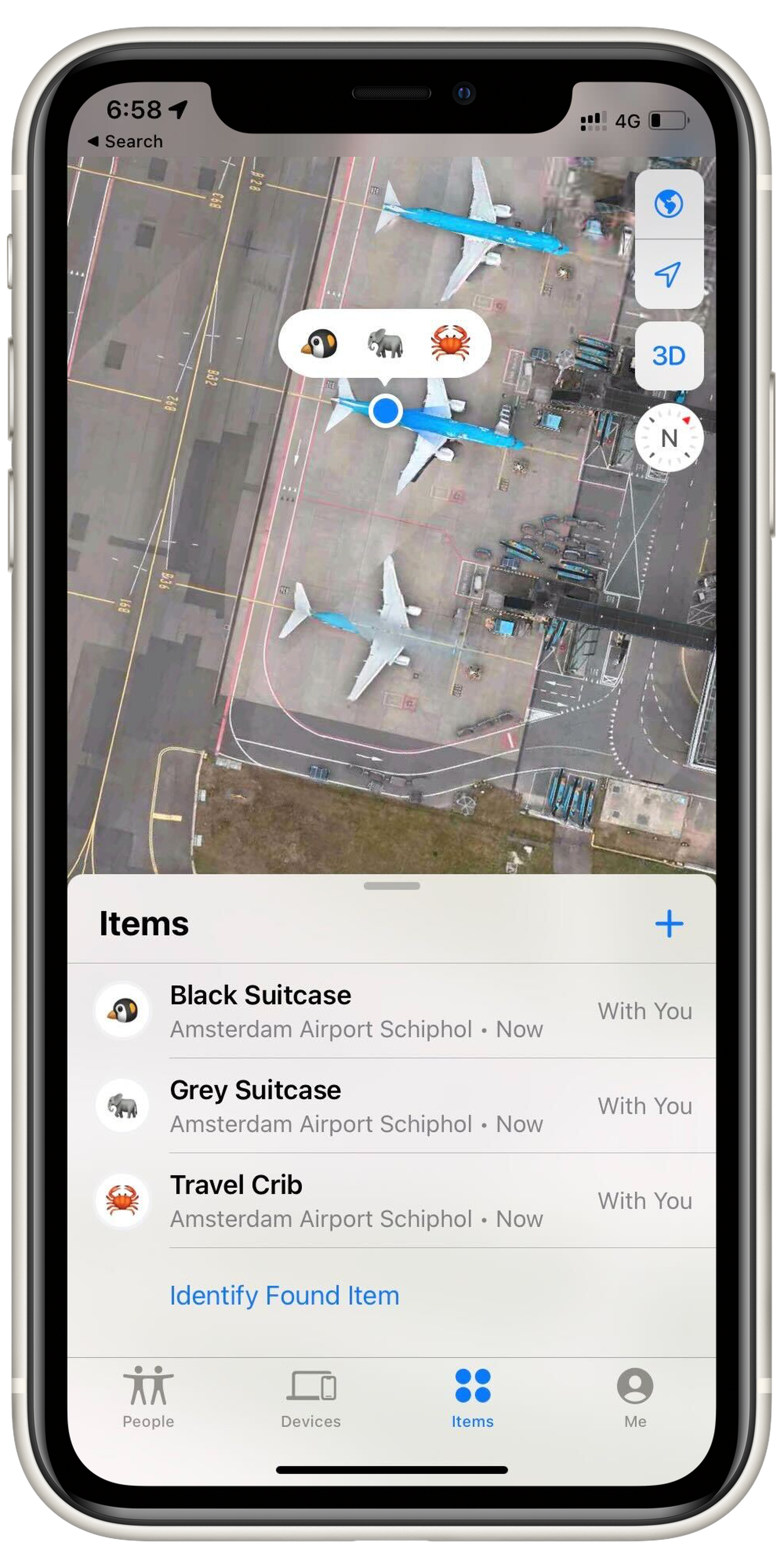 A screenshot of the Items tab in Apple’s Find My app. It shows three items: Black Suitcase, Grey Suitcase, and Travel Crib. Each has the location Amsterdam Airport Schiphol, and the location dot for each is superimposed on a satellite image of a plane at the airport.