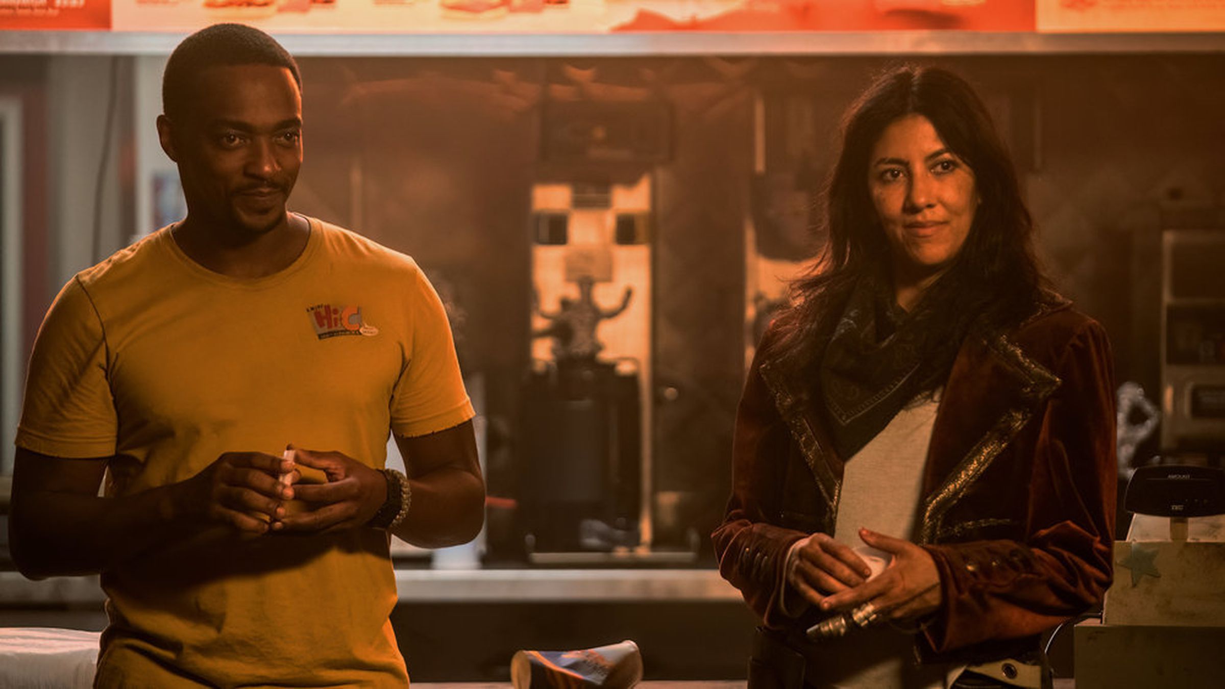 A still photo of Anthony Mackie and Stephanie Beatriz in the Twisted Metal TV show on Peacock.