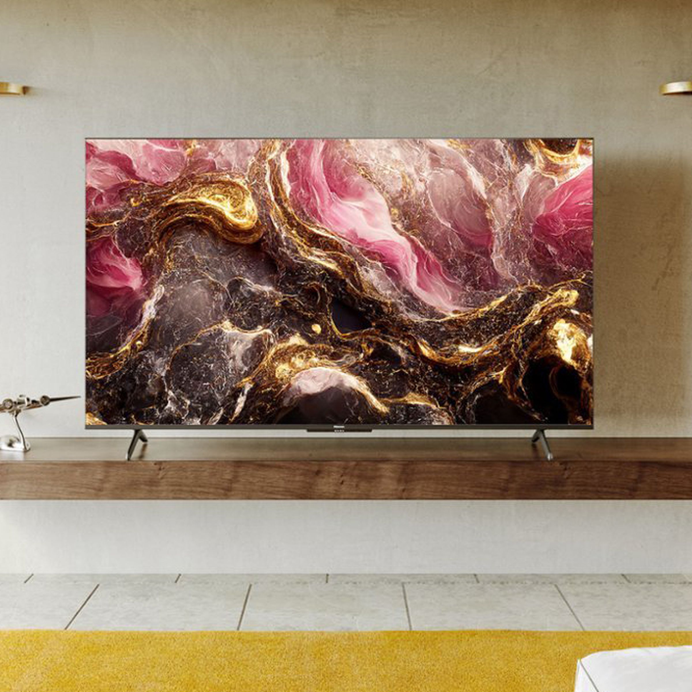 An image of Hisense’s 55-inch U6K Series TV resting on a wooden shelf in a white room.
