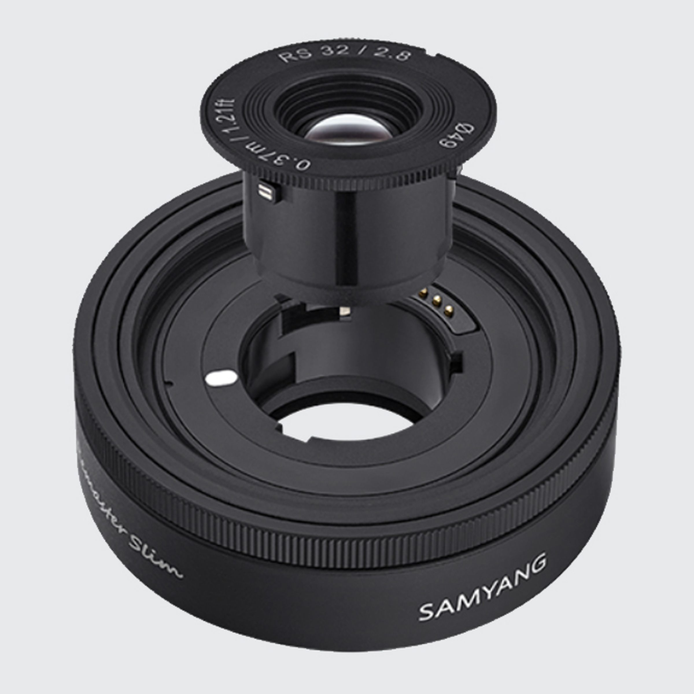 The Samyang Remaster Slim prime lens with its optical glass elements removed.