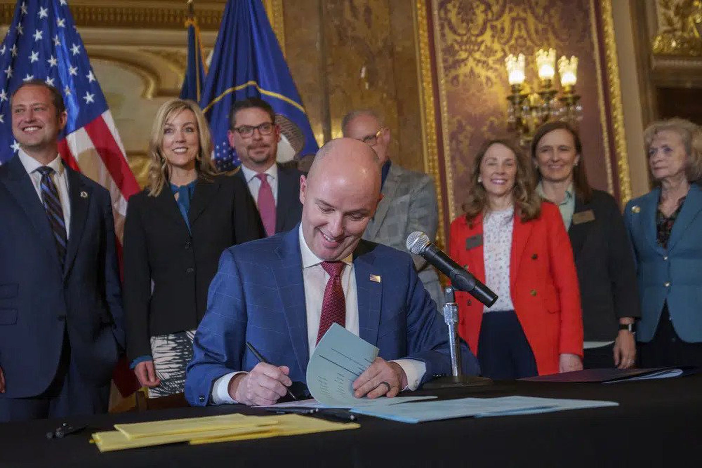 Gov. Spencer Cox signs two regulation bills that limit when and where children can use social media during a ceremony at the Capitol building in Salt Lake City on Thursday, March 23rd, 2023.