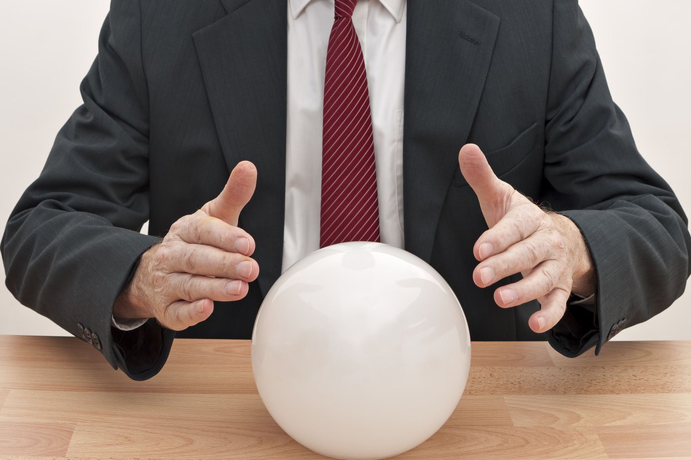 businessman with crystal ball shutterstock