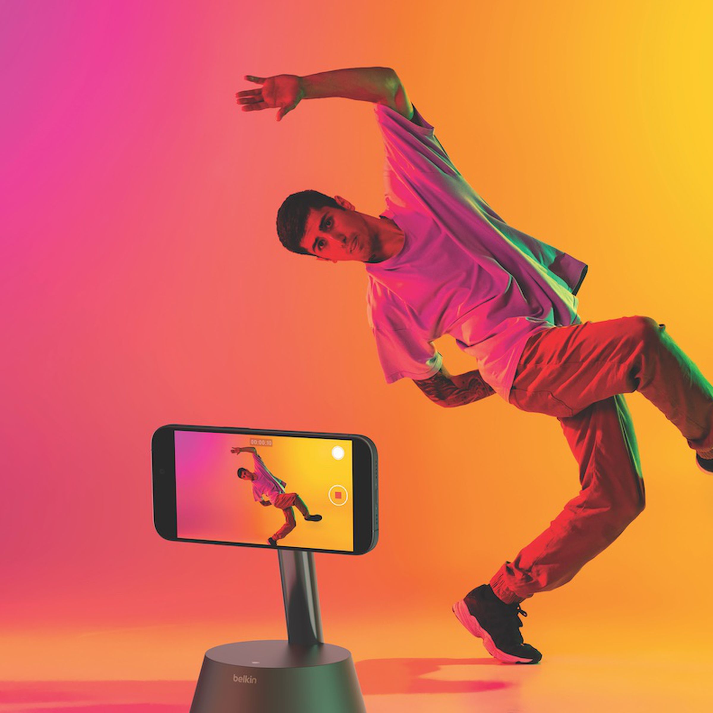 An image showing a person dancing in front of the Belkin Stand Pro