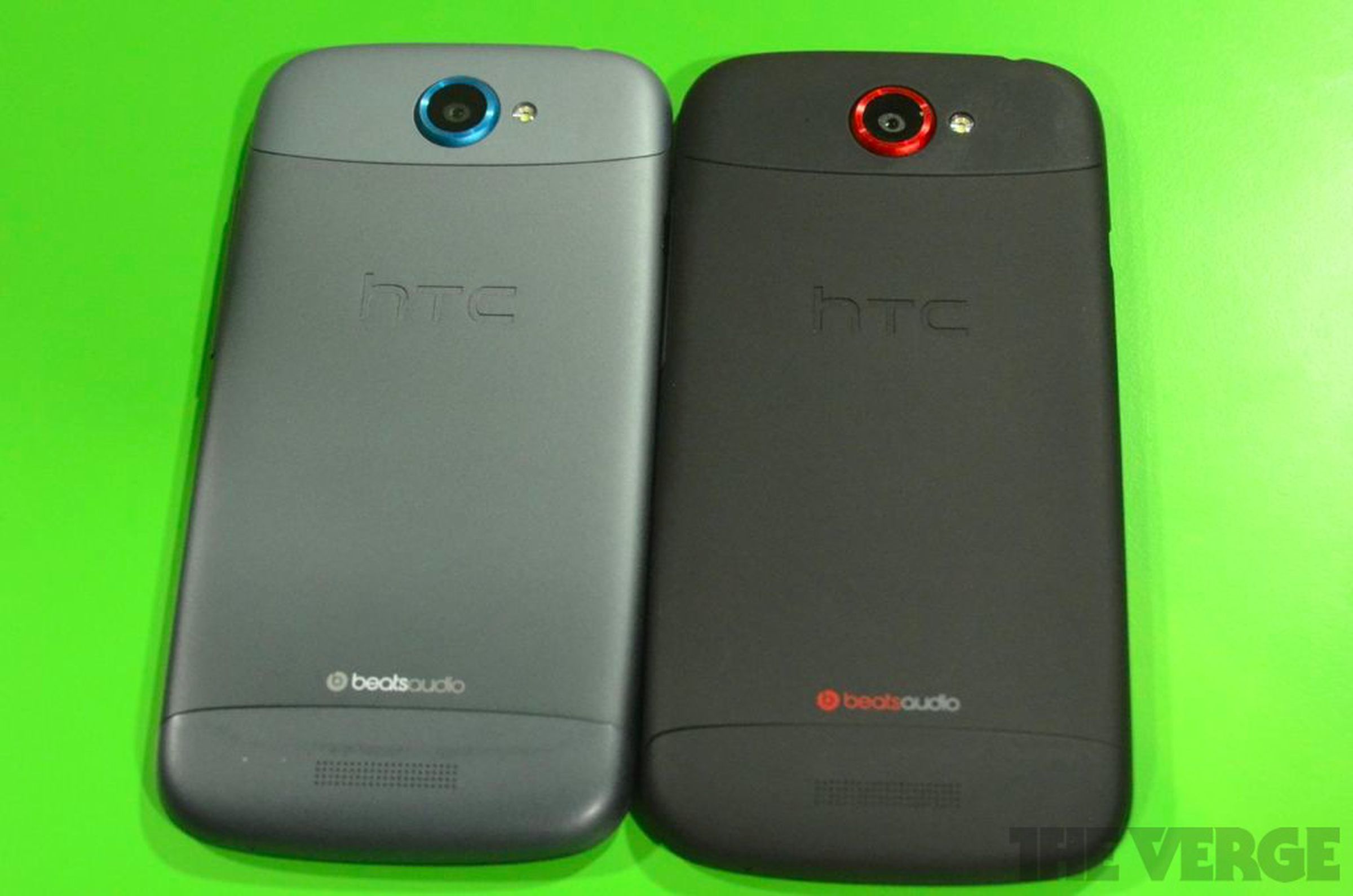 HTC One S in gray and One X in black hands on photos