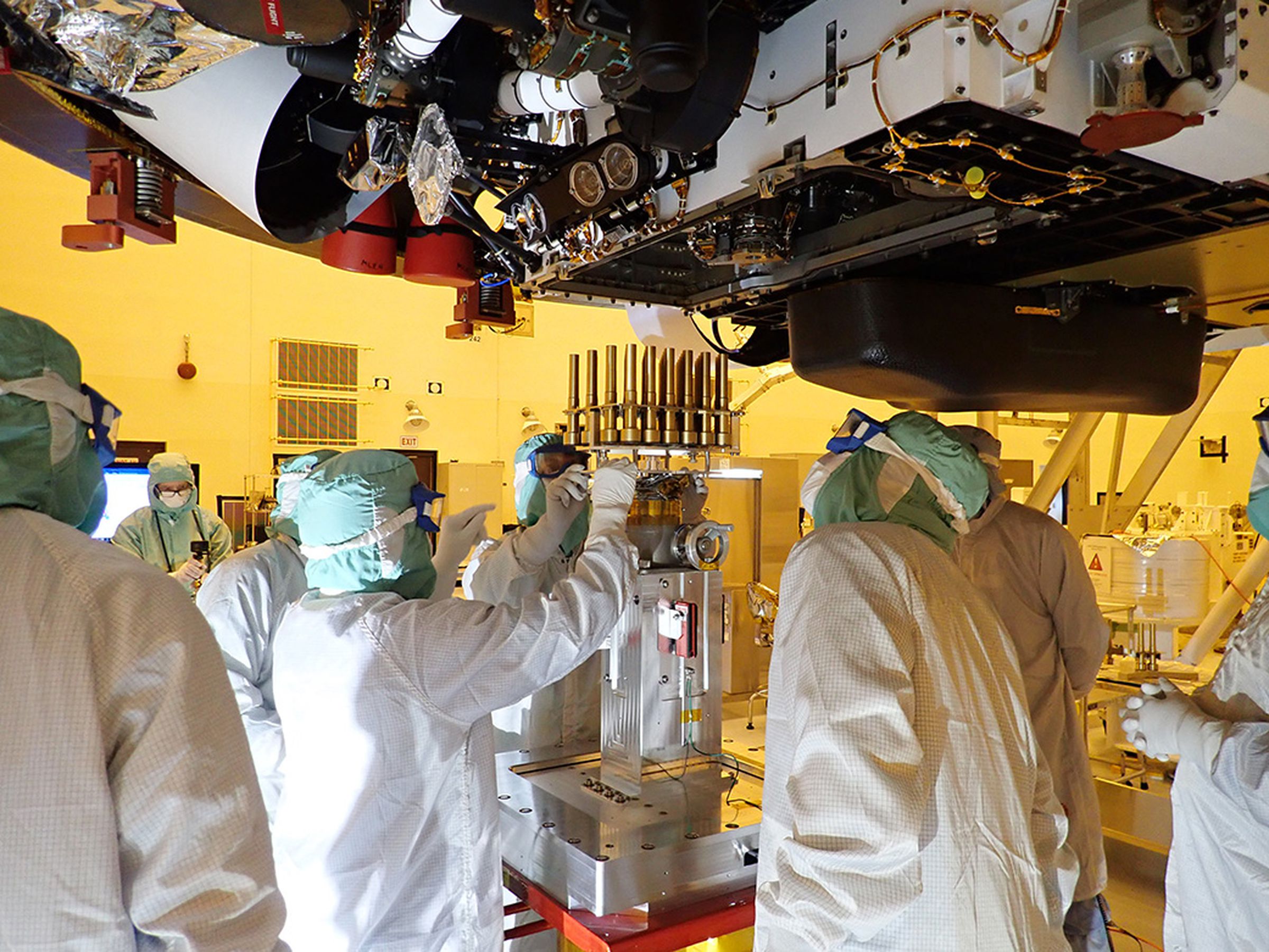 Engineers load the titanium sample tubes into Perseverance ahead of launch.