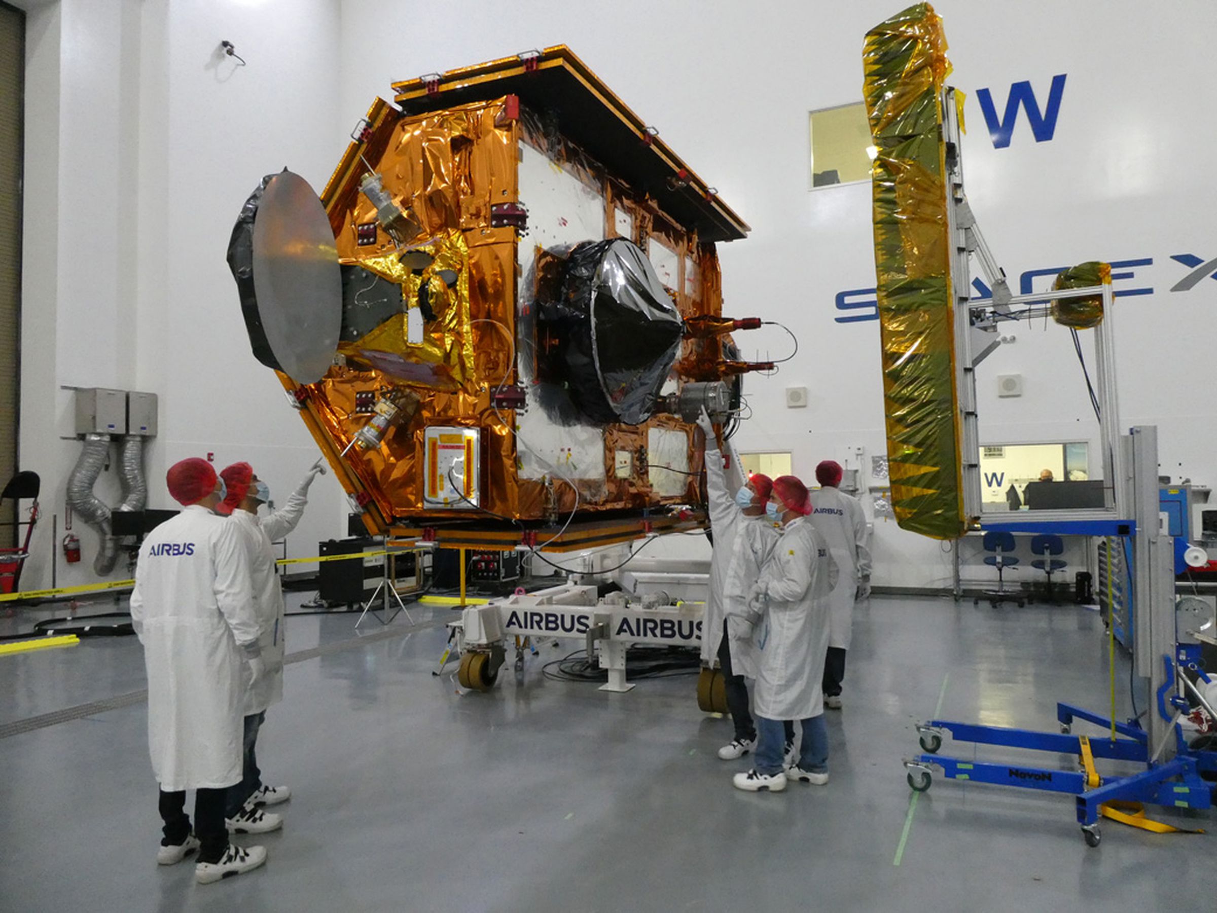 Sentinel-6 Michael Freilich team members from European Space Agency pose with the spacecraft during processing.