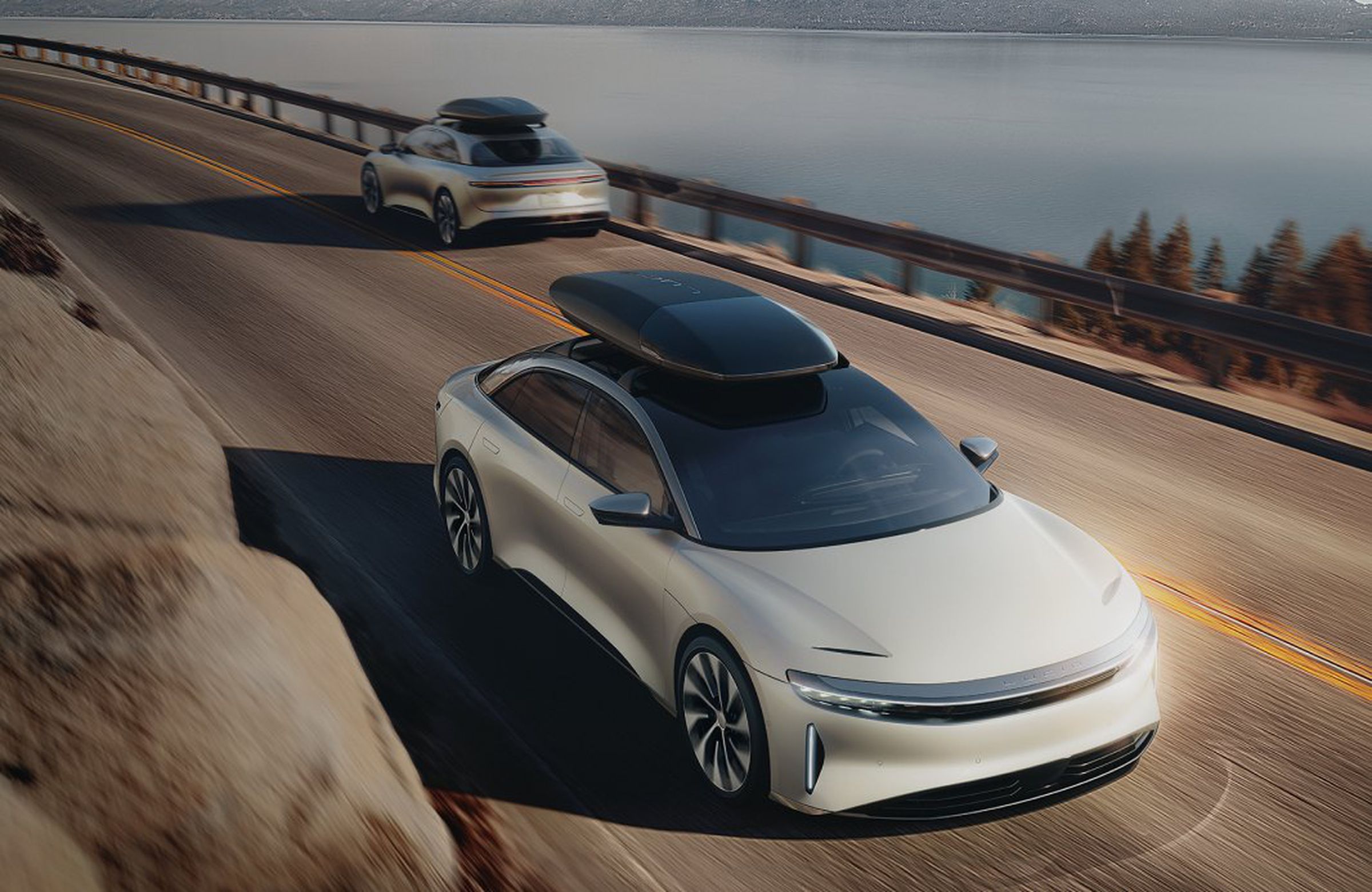 Lucid Air Cargo Capsule roof-mounted storage shown on top of a sedan in a rendered image.