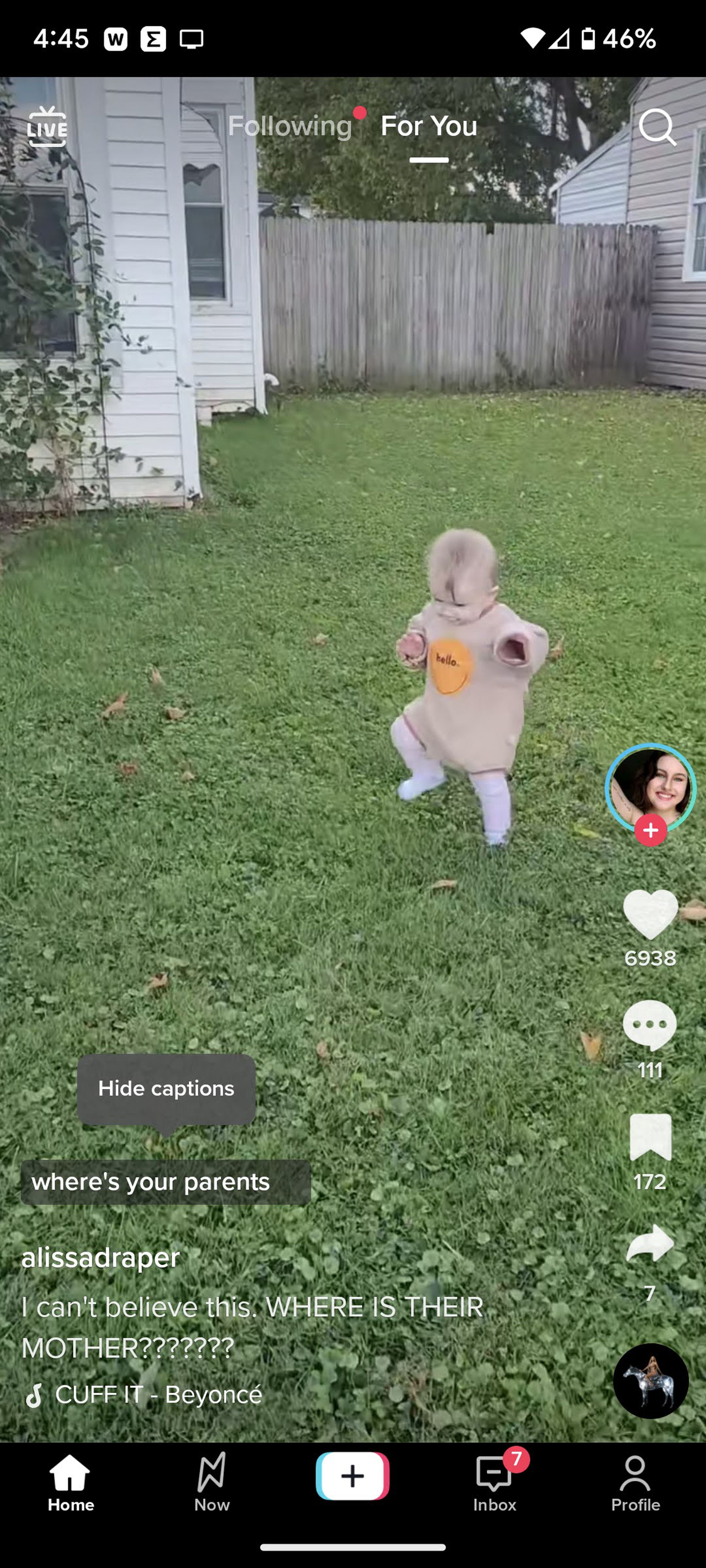 TikTok still of baby on lawn with closed captions.
