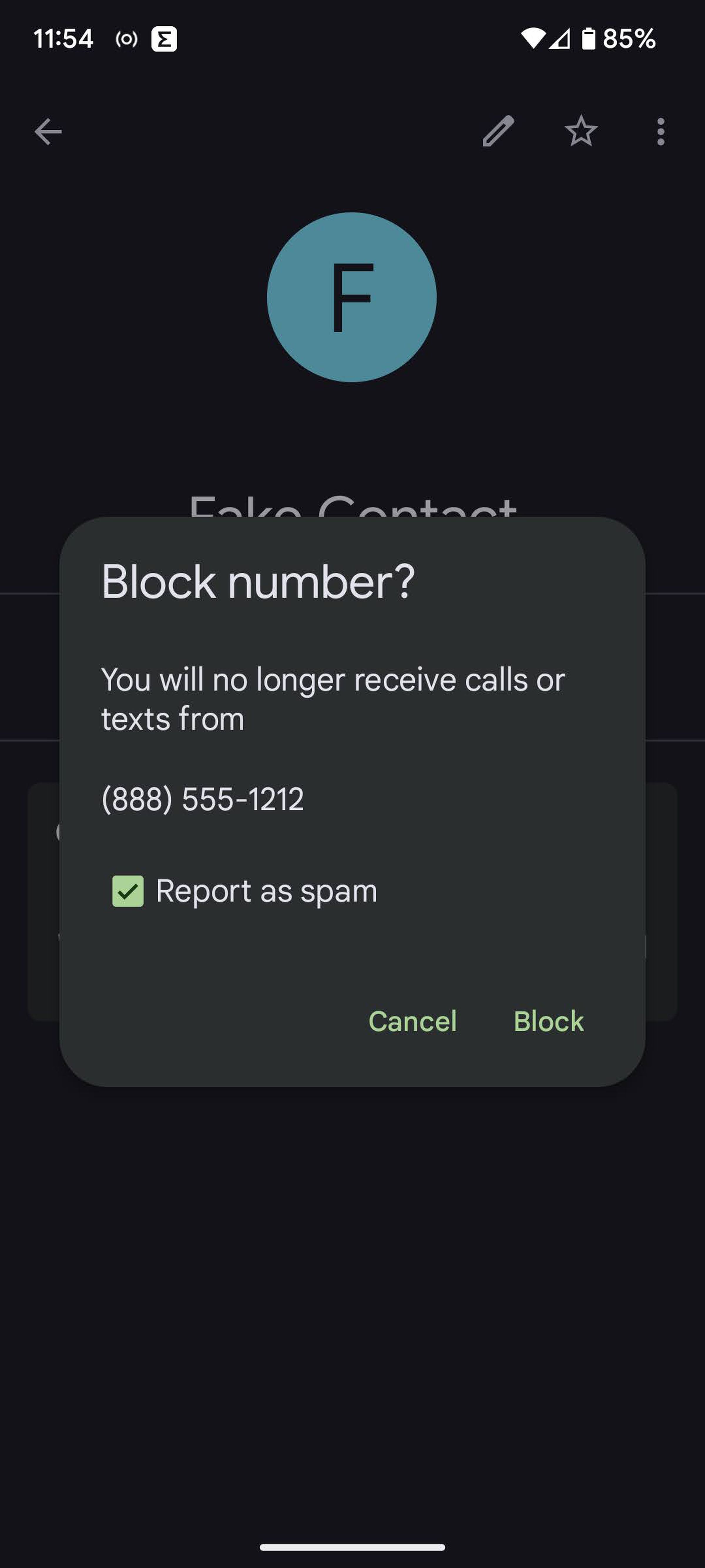 On a mobile page, a popup window asked if you want to block a number, and lets you check a box that will report it as spam.