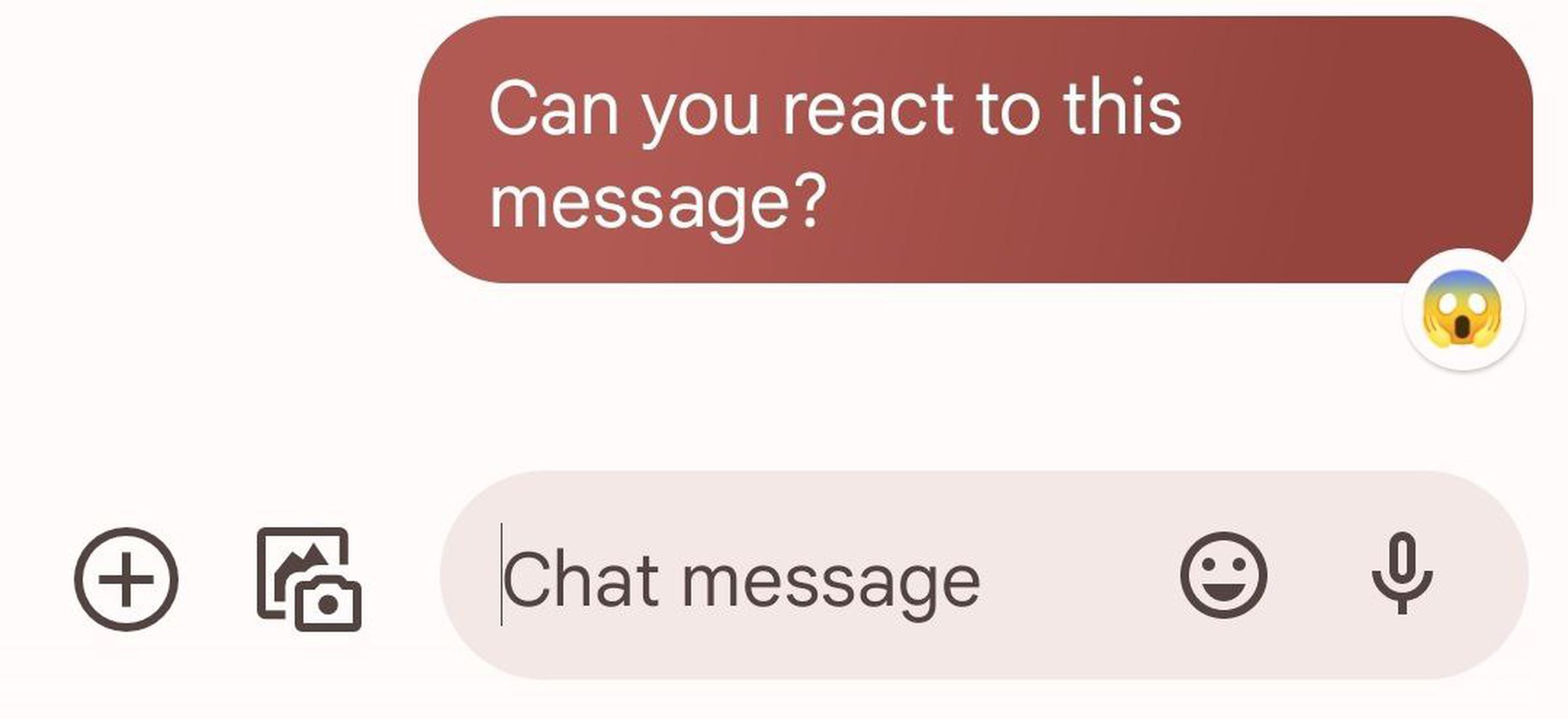 Screenshot of a text saying “Can you react to this message?” A face screaming in fear emoji is added to the message bubble.