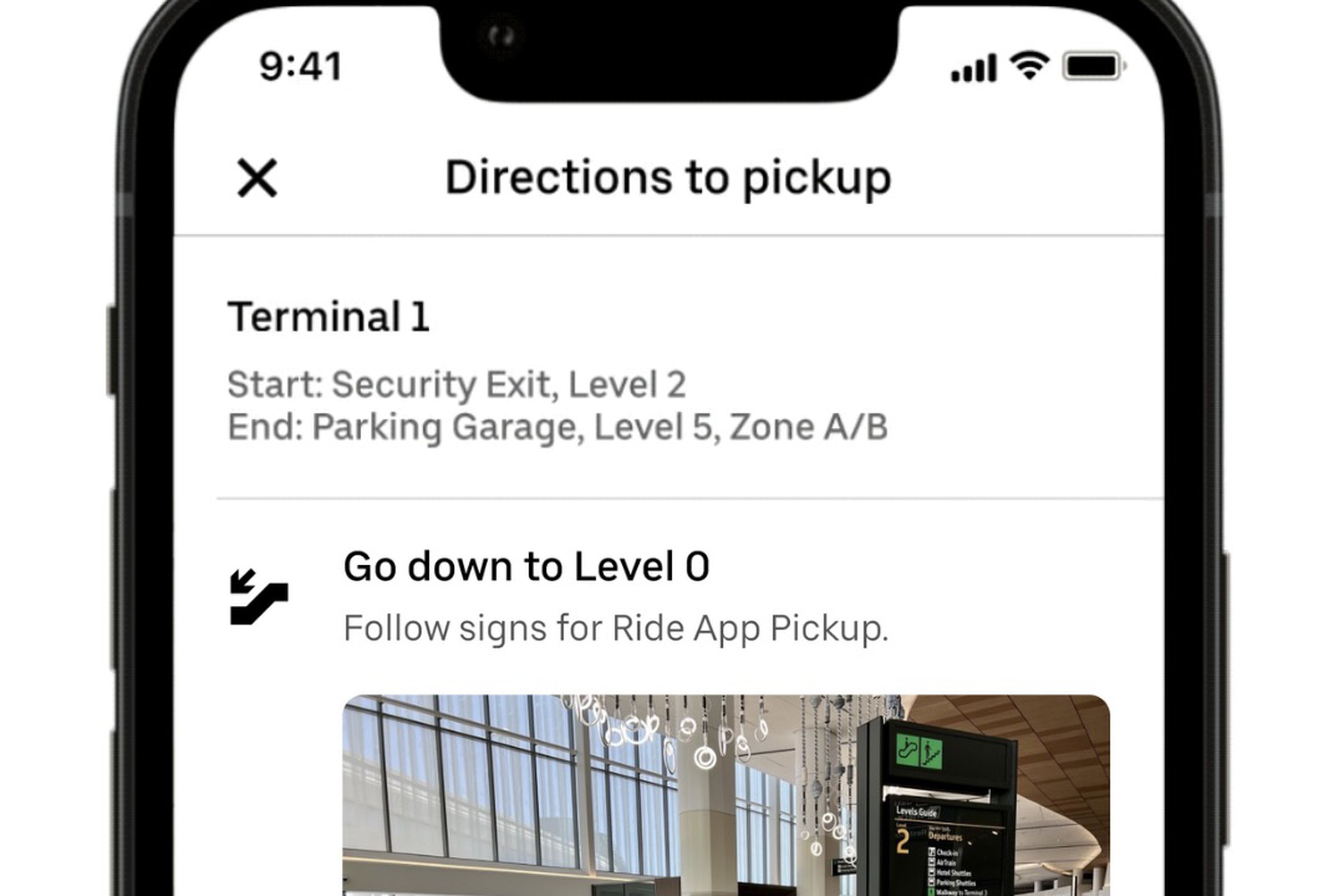 Uber app on an iPhone showing directions to pickup. The instructions for terminal 1 start at security exit, level 2 abd end at parking garage level 5 zone A B.