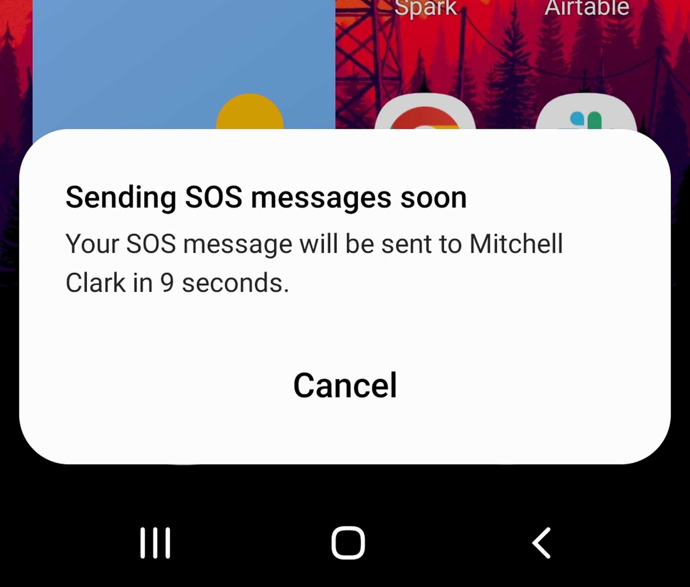 Image showing a dialog box that reads: “Sending SOS messages soon. Your SOS message will be sent to Mitchell Clark in 9 seconds,” followed by a cancel button.