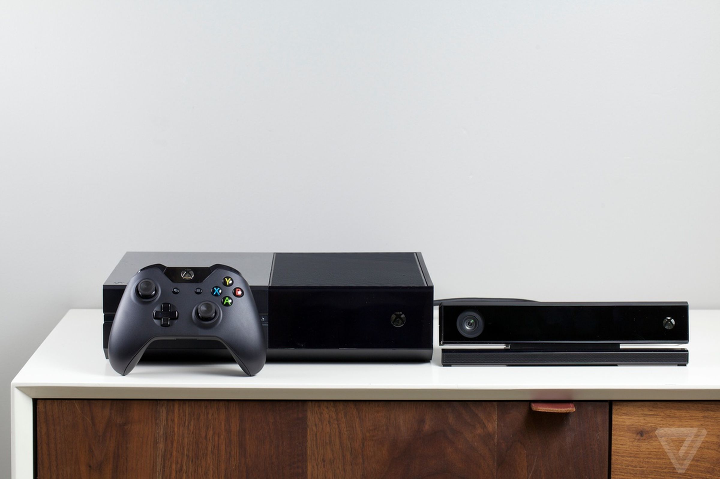 The original Xbox One alongside its Kinect camera.