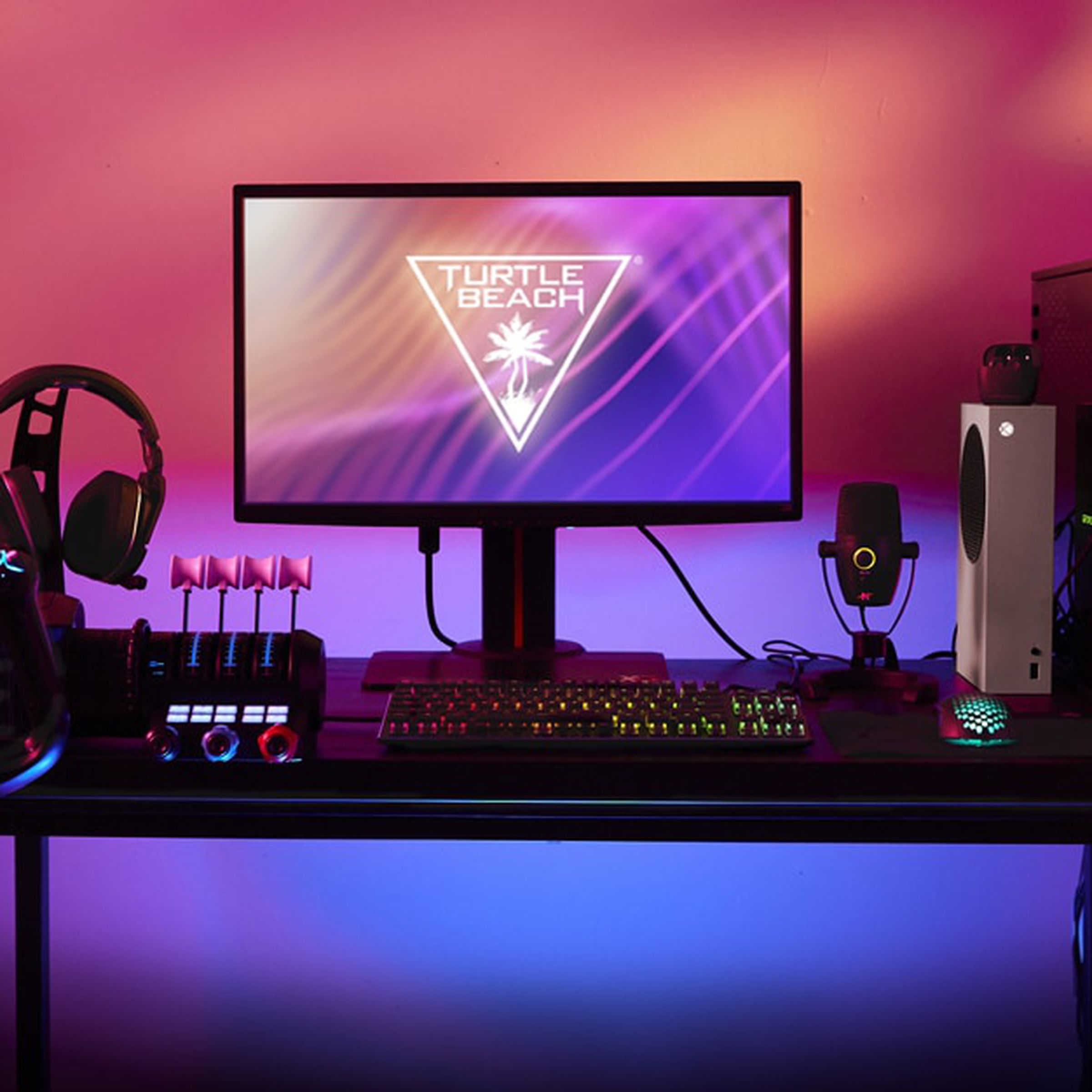 A picture of a PC with several Turtle Beach accessories on the desk.