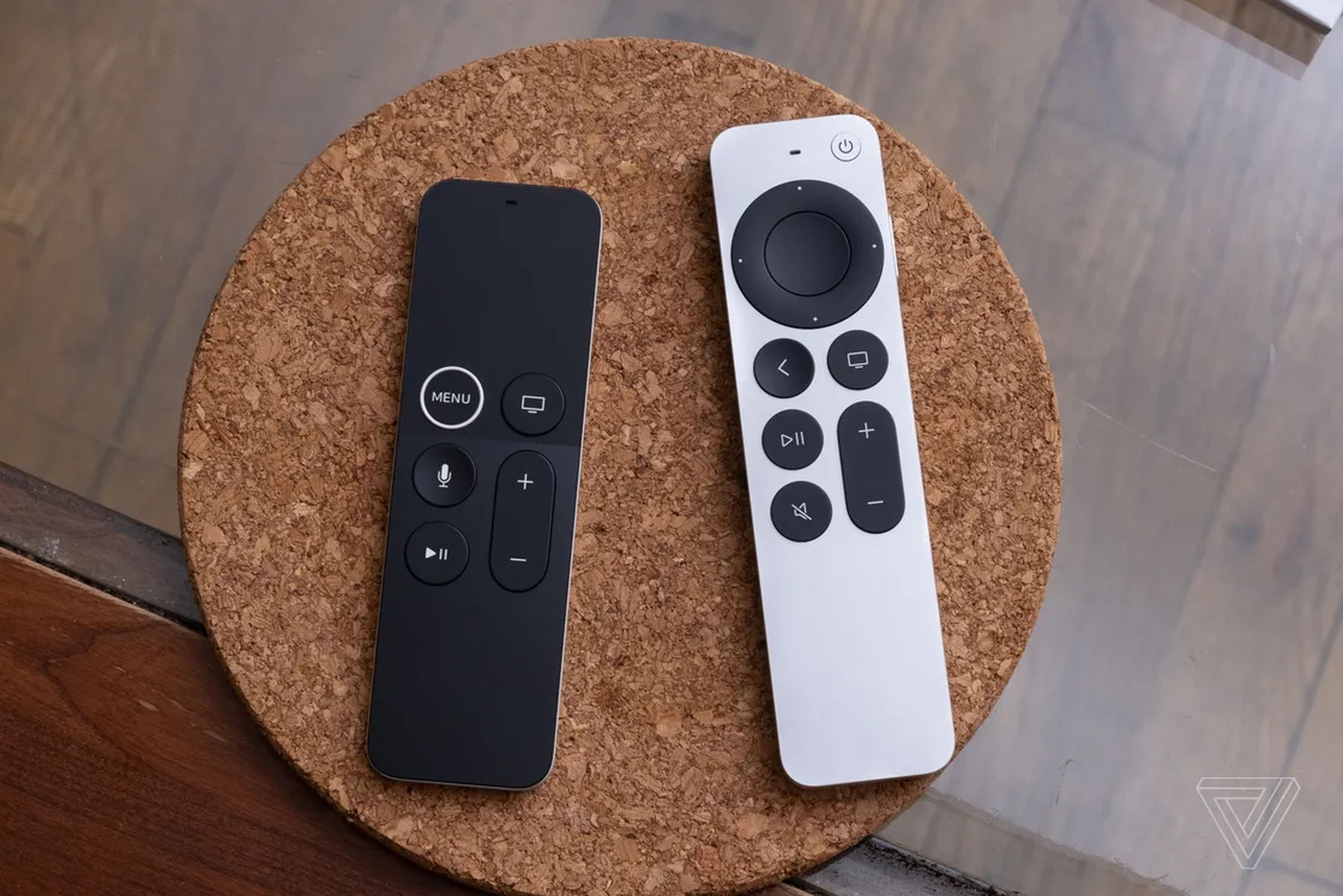 The first-generation Siri Remote is on the left, and the second-generation remote is on the right. 