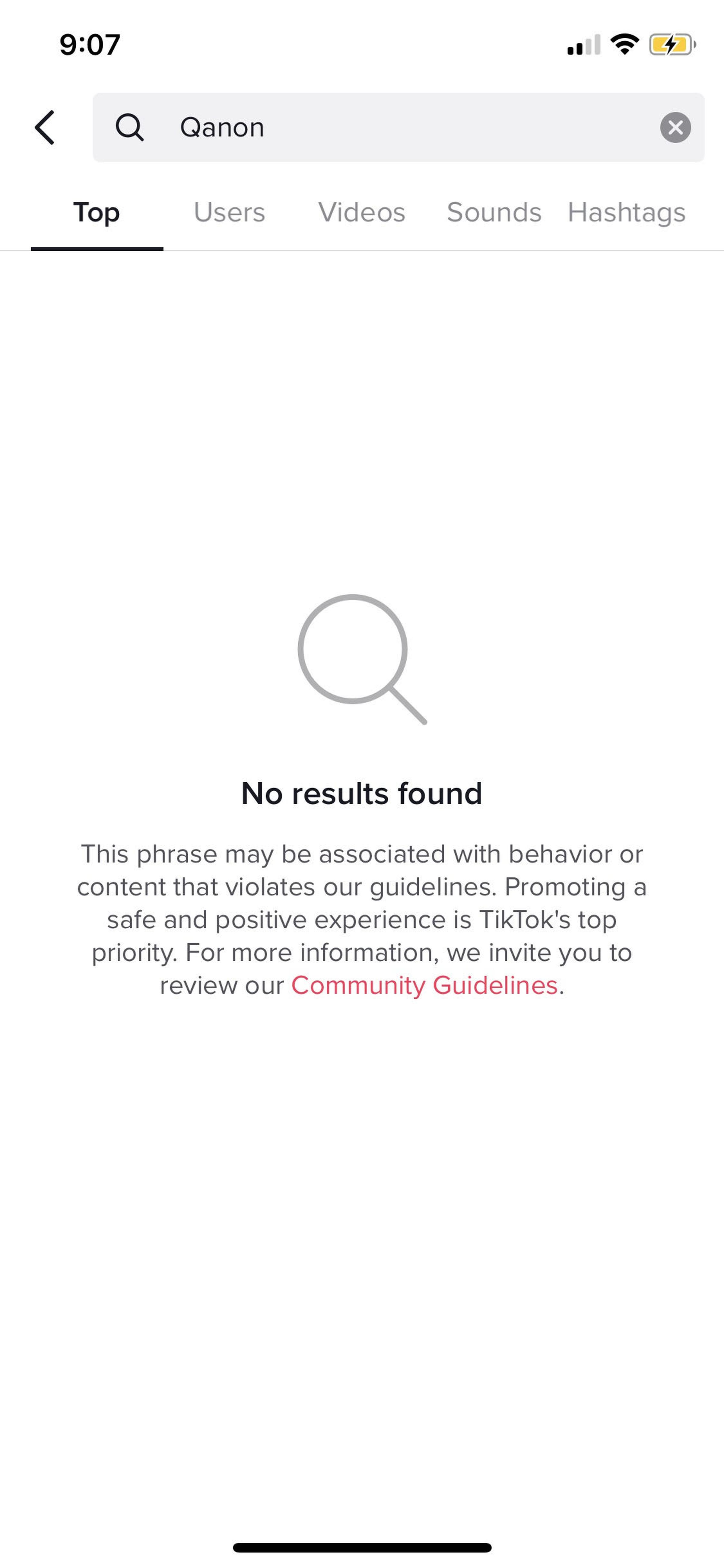 A search for QAnon on TikTok brings up its community guidelines