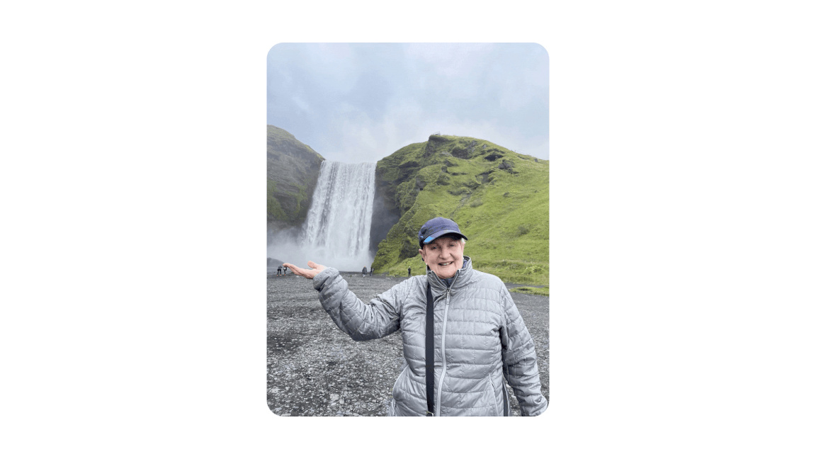 A photo of a person in front of a waterfall being edited using Magic Editor.