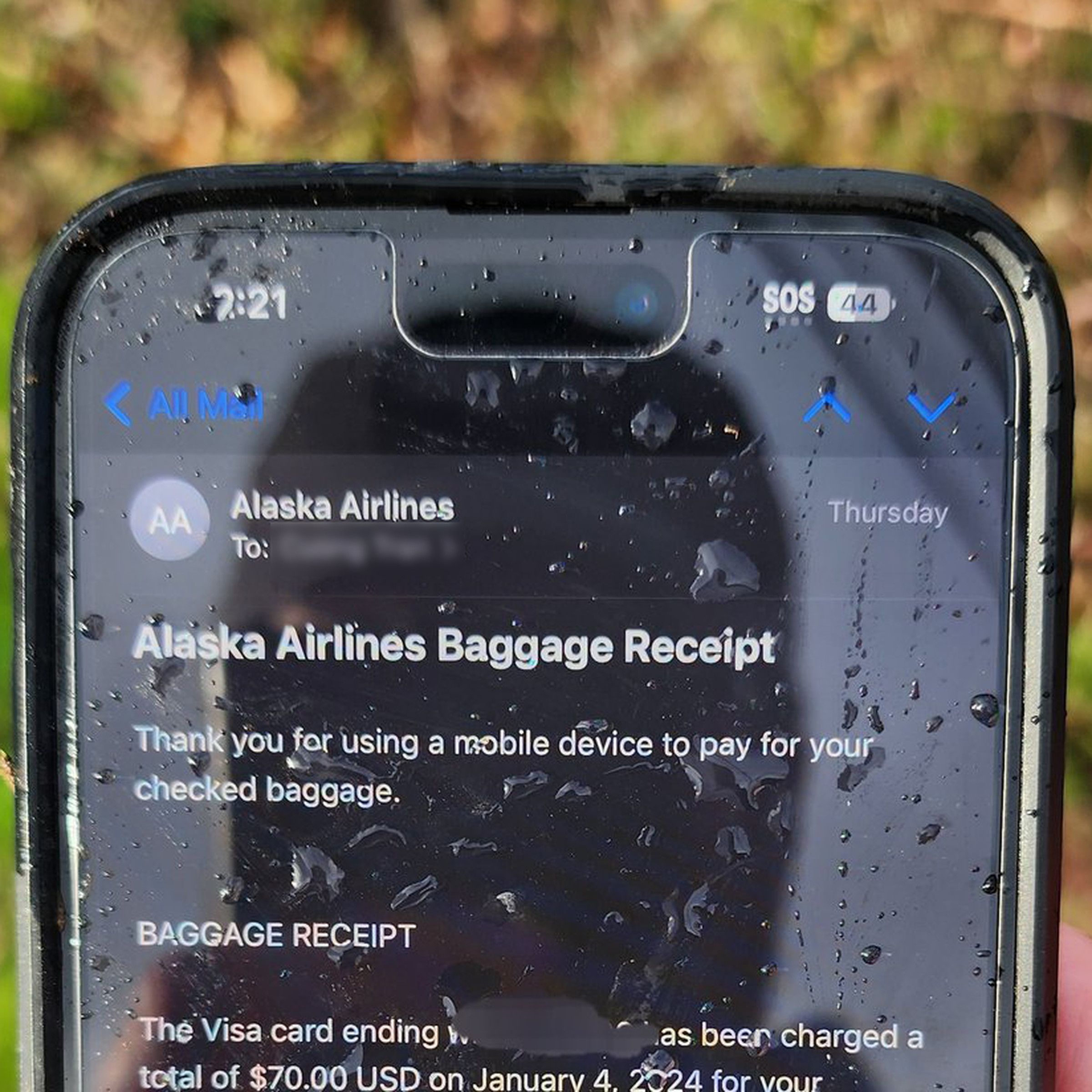 A picture of the top half of an iPhone showing an airline baggage receipt.