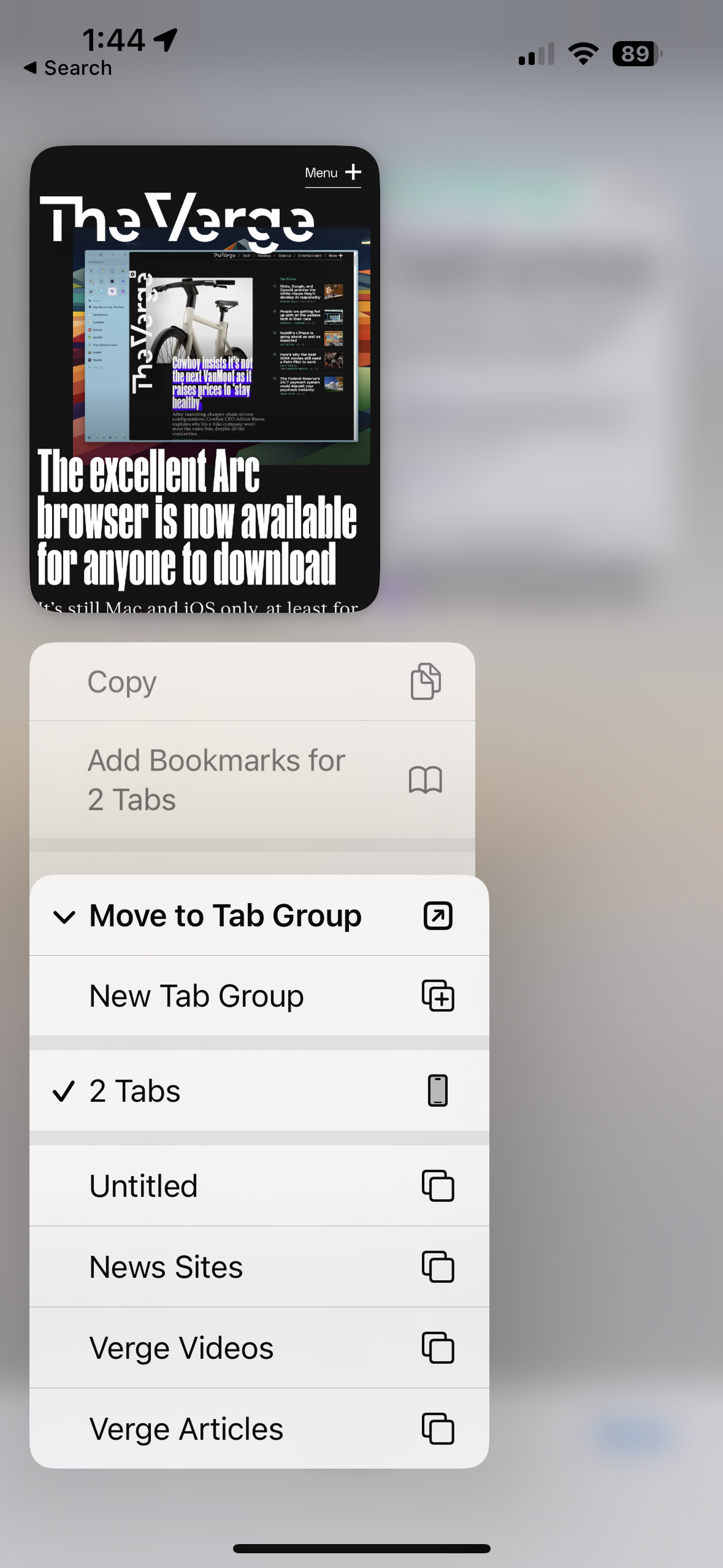 A screenshot of Safari on iOS with a tab highlighted and Move to Tab Group selected.