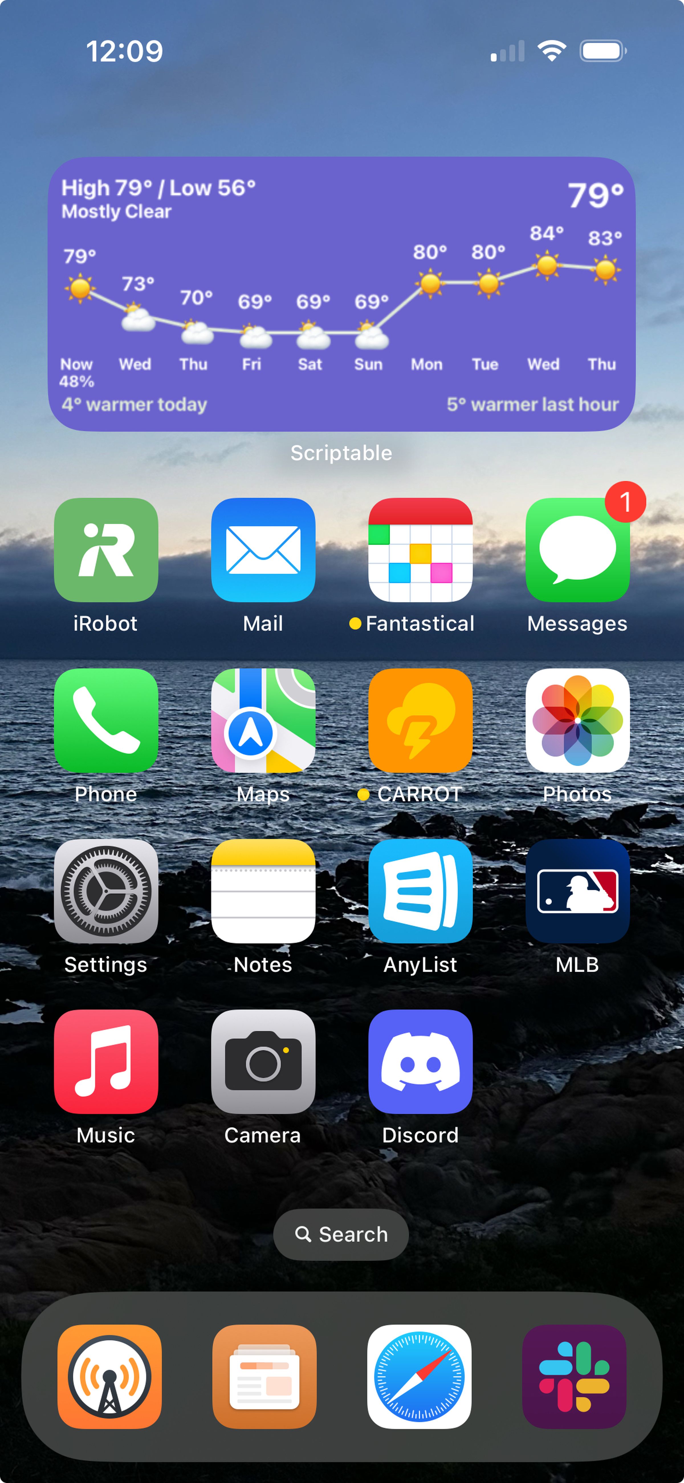 An iPhone home screen with a wallpaper showing a beach.