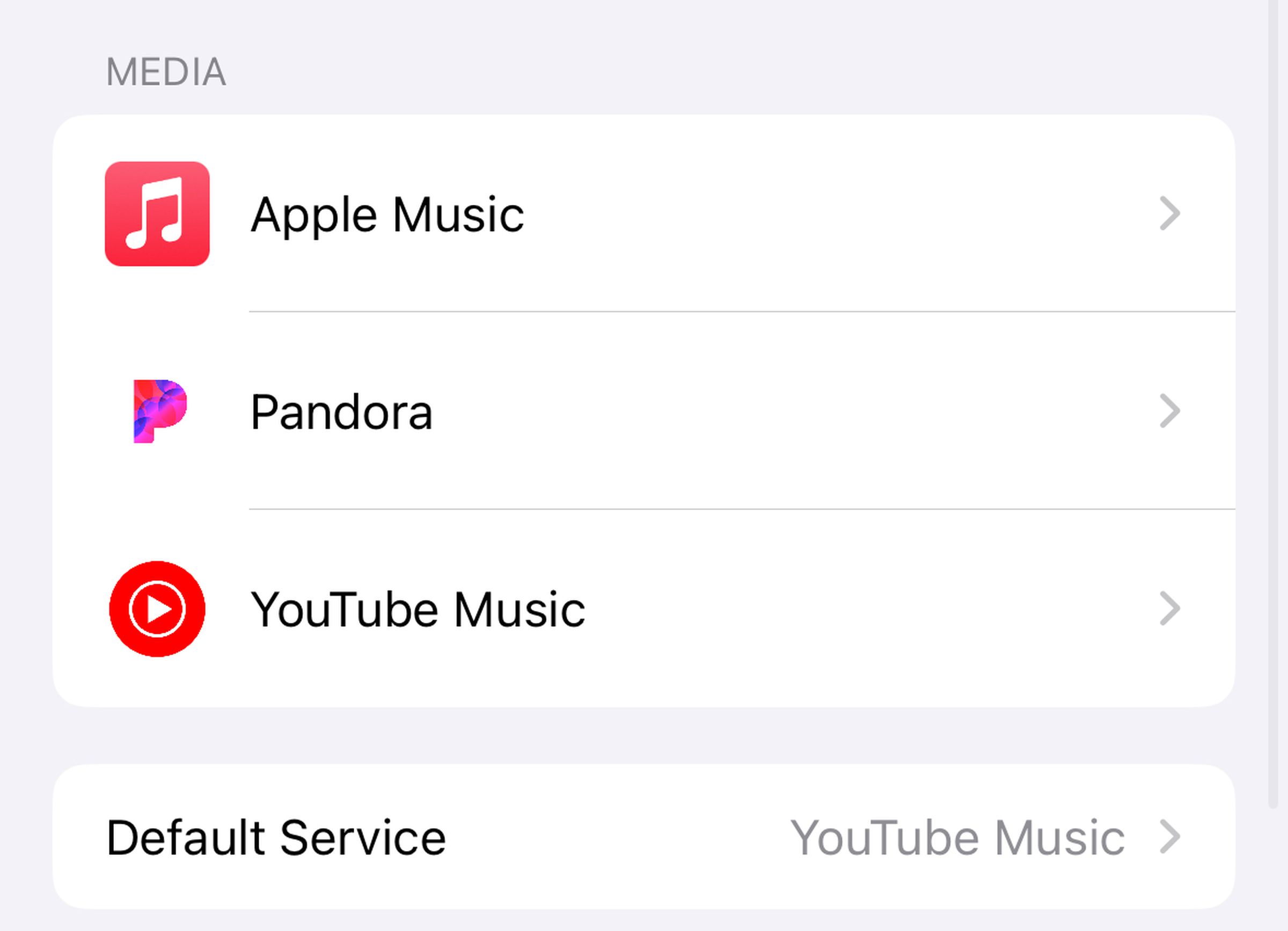 A screenshot showing the available HomePod media services in the Apple Home app. It lists Apple Music, Pandora, and YouTube Music, and shows YouTube Music as the Default Service.