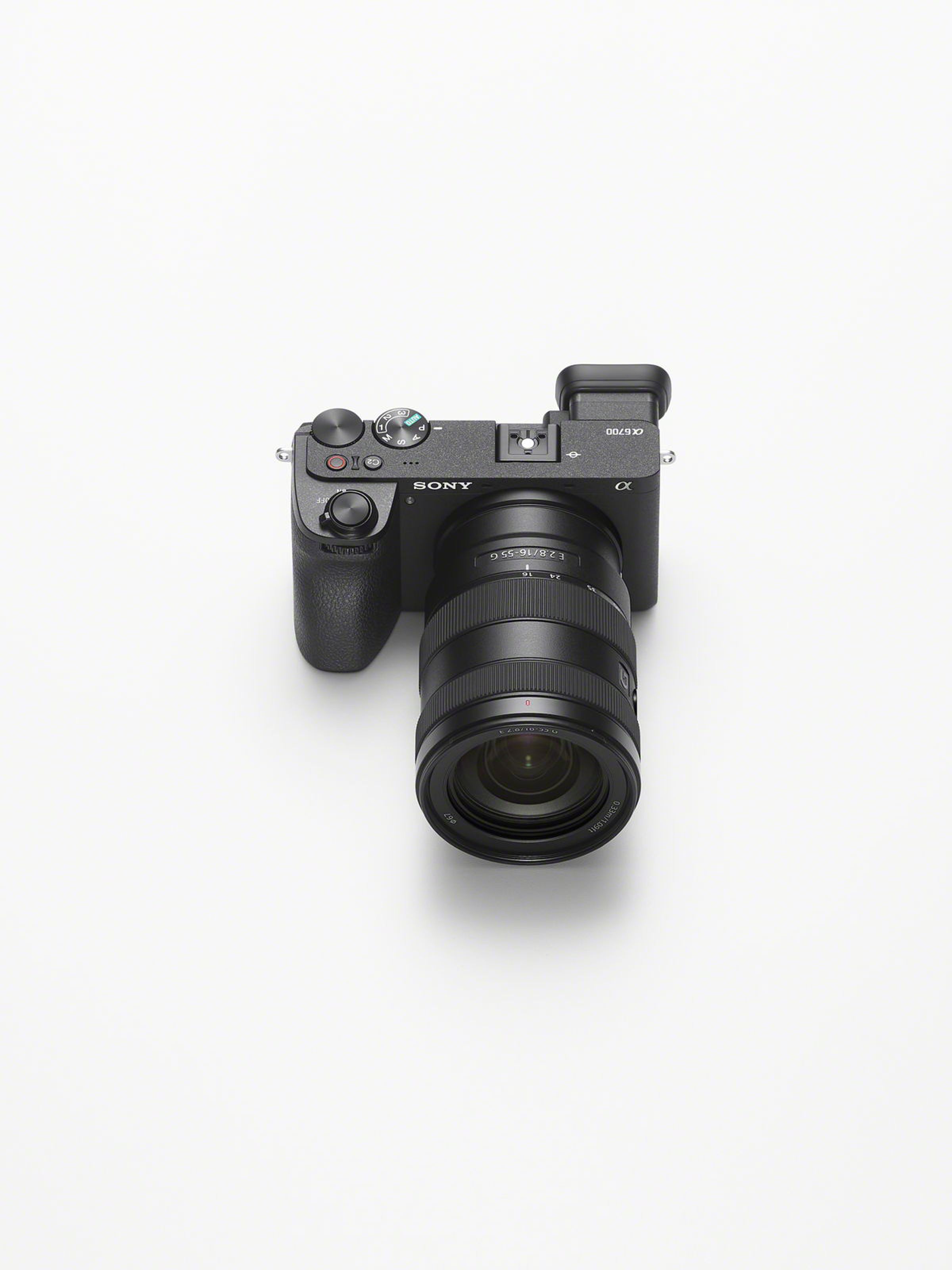 Top-down view showing the Sony A6700 with a telephoto lens