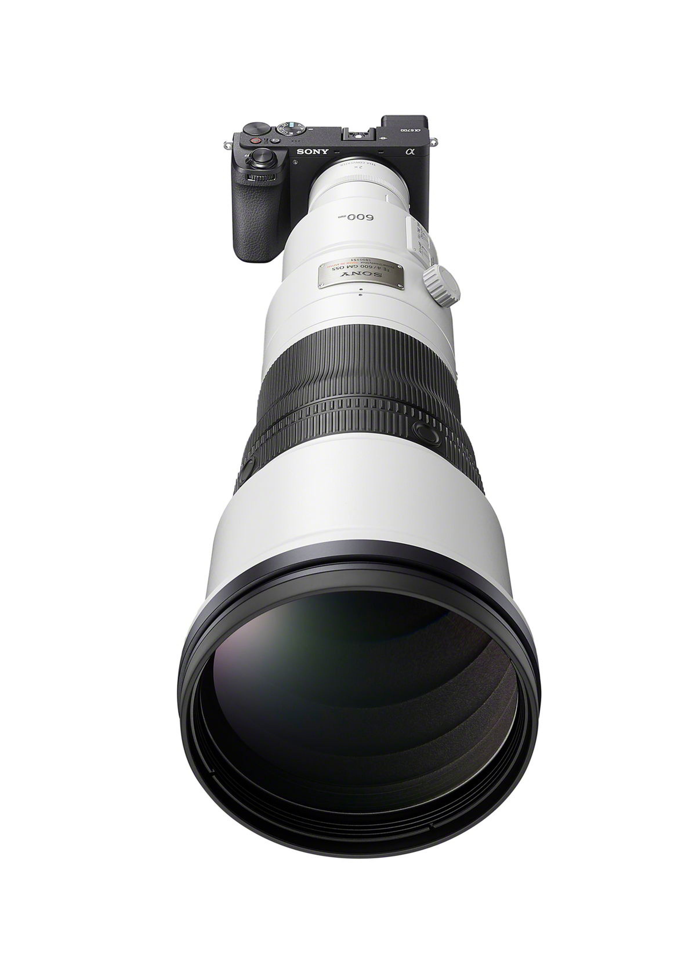 Front view showing the camera with a long zoom lens.