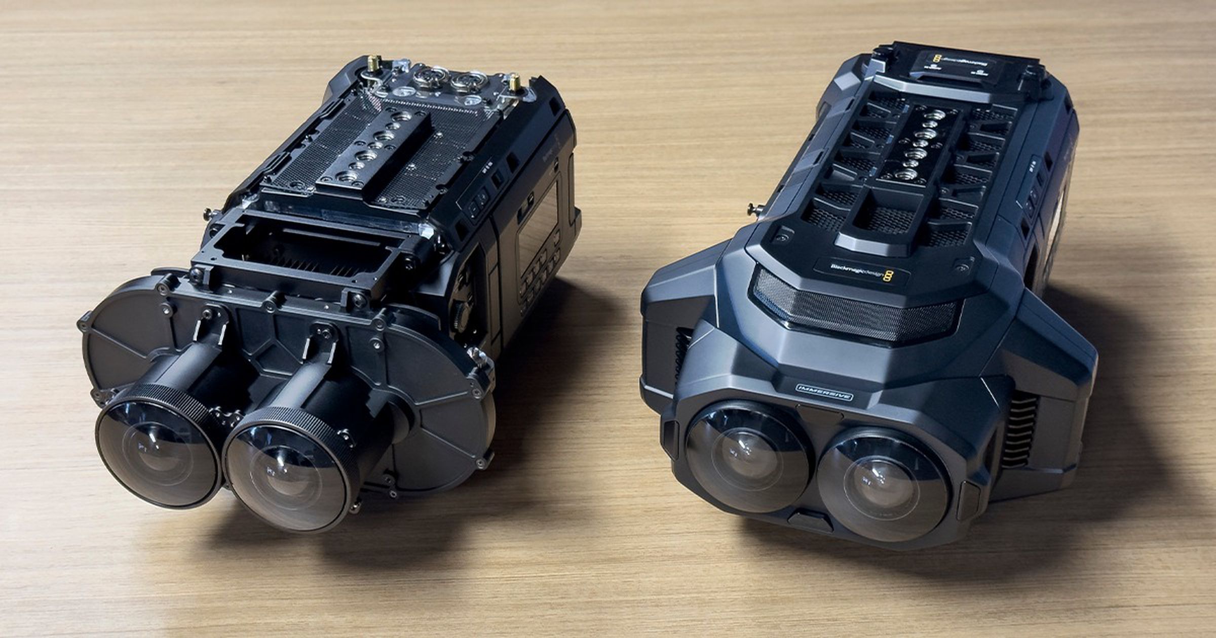 Two of the camera, viewed side-by-side, one with the front cover piece removed.