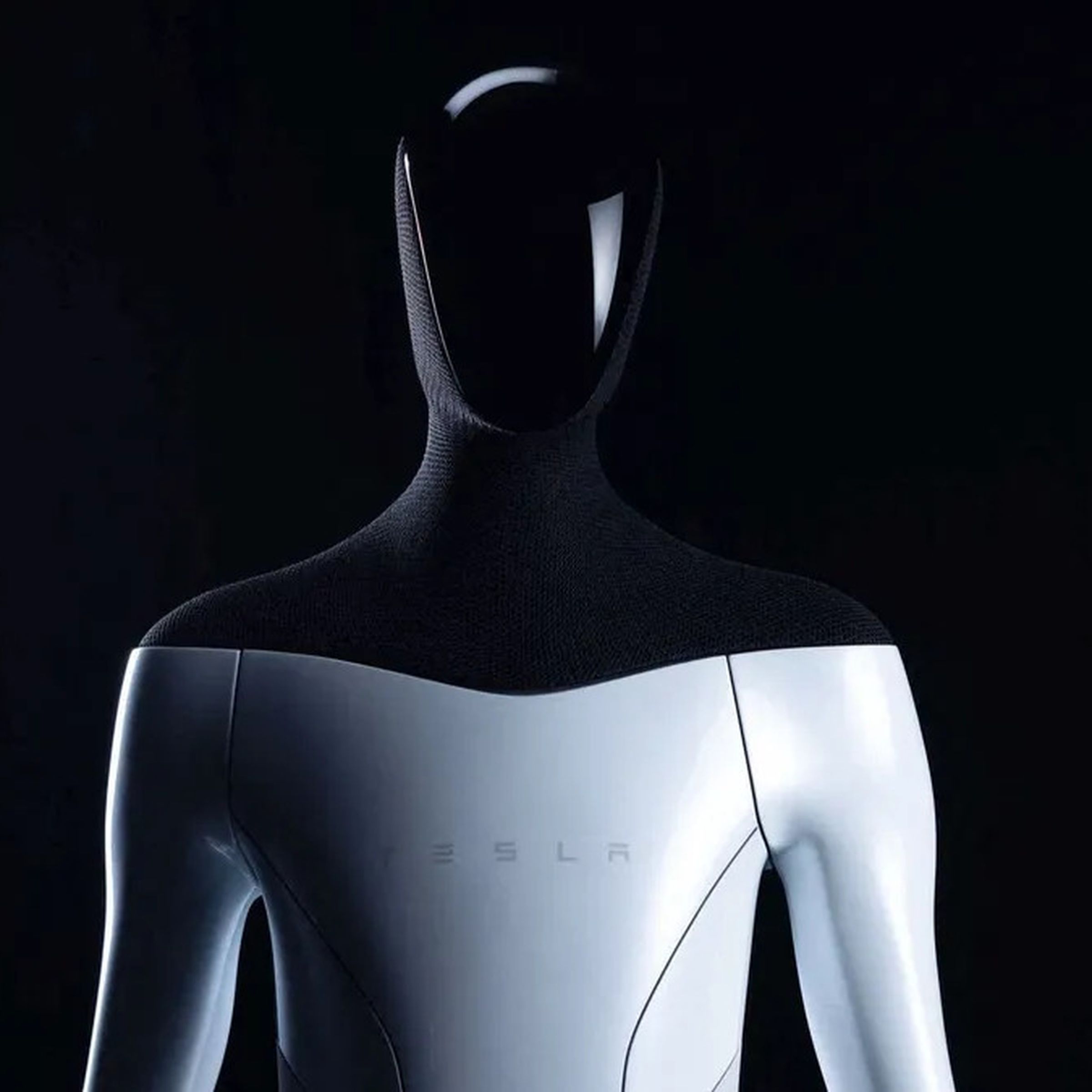A CGI rendering of the Tesla Bot showing a humanoid, faceless robot from the torso up. 
