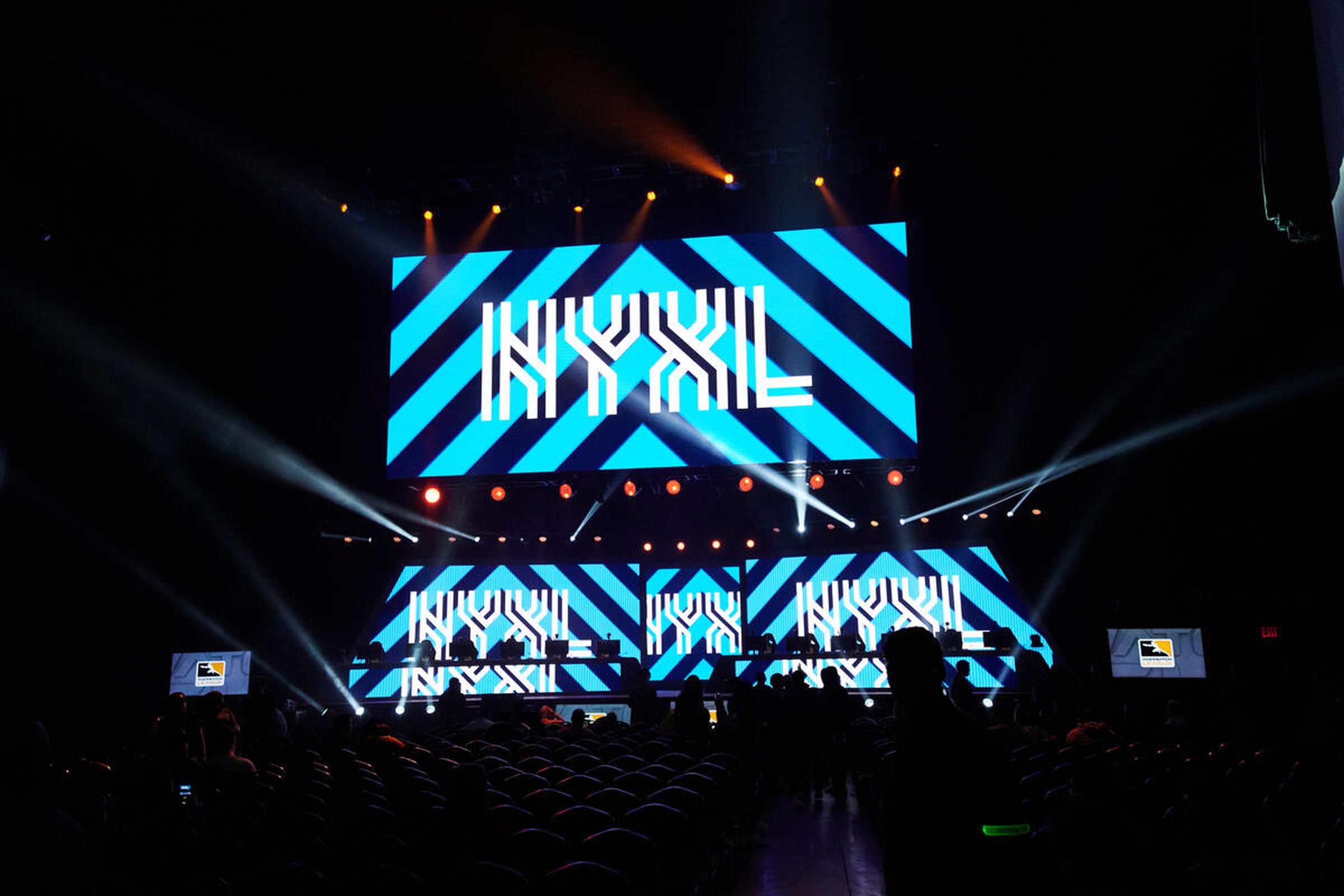 Photo from the Overwatch League’s New York Excelsior homestand event depicting a large LED screen with the NYXL blue logo