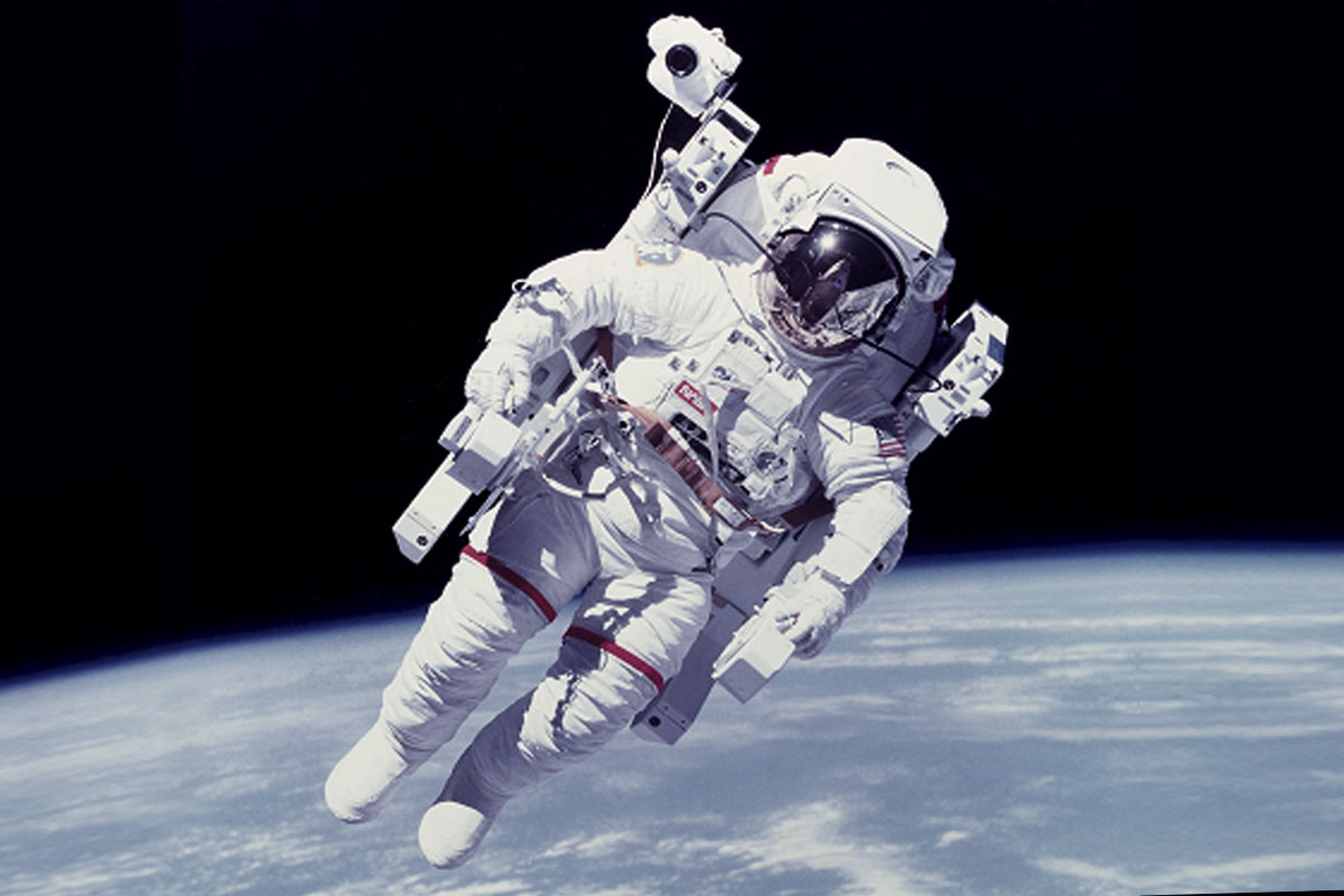 A NASA astronaut testing out a propulsion unit during an untethered spacewalk