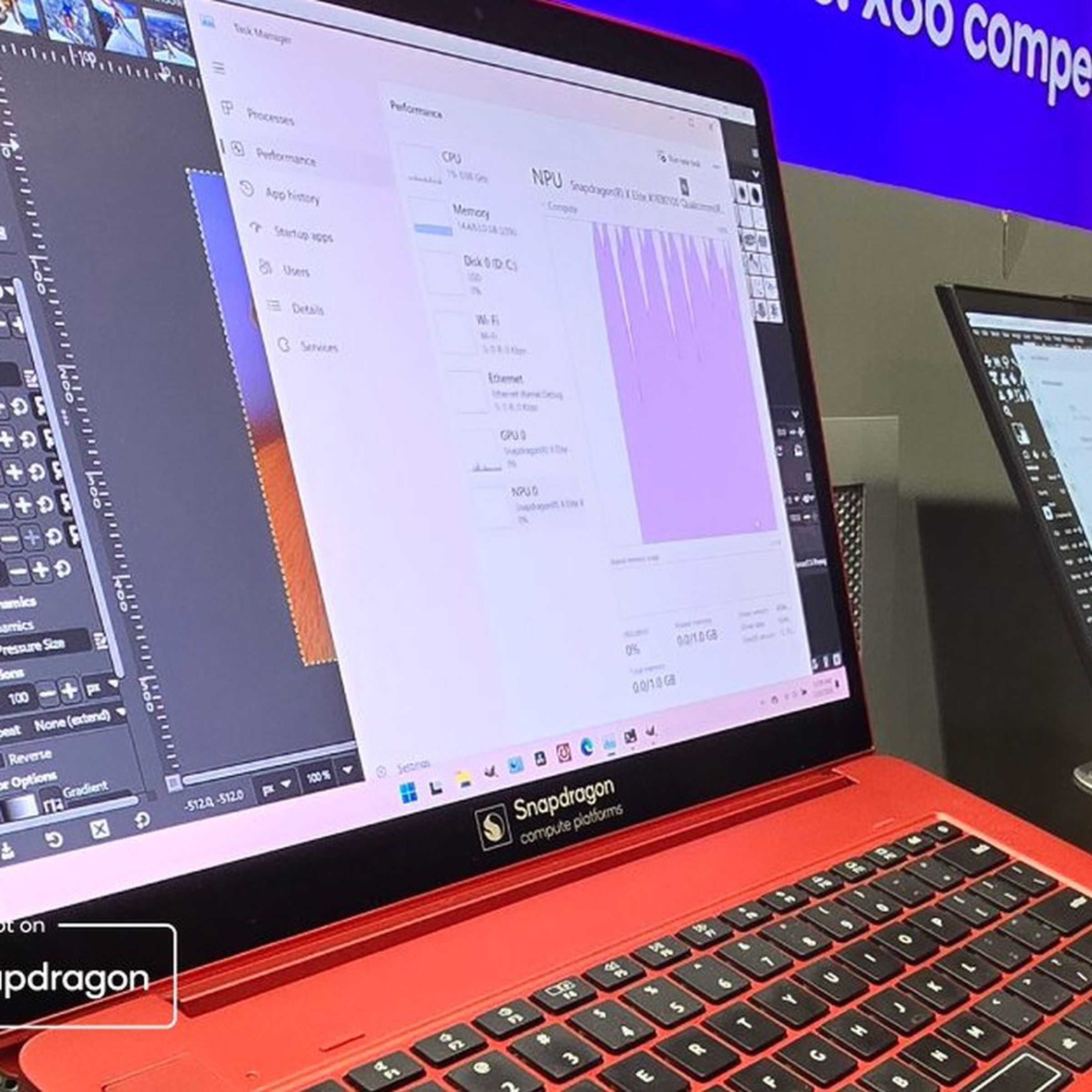 The red Snapdragon X Elite reference design laptop Qualcomm used to show off the games.