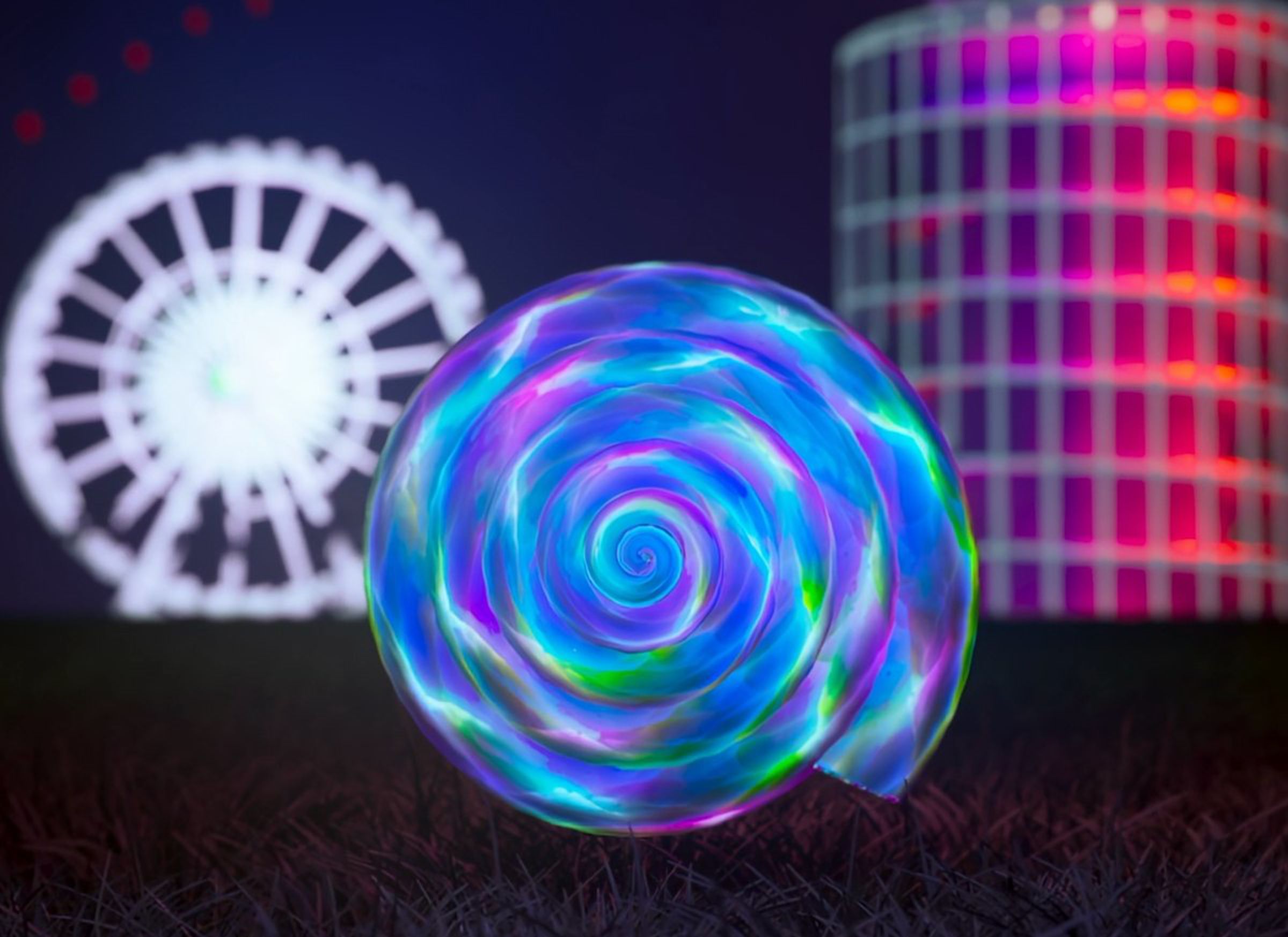A rendering of a multicolored “shell from a forgotten sea” shown on the field where Coachella takes place.