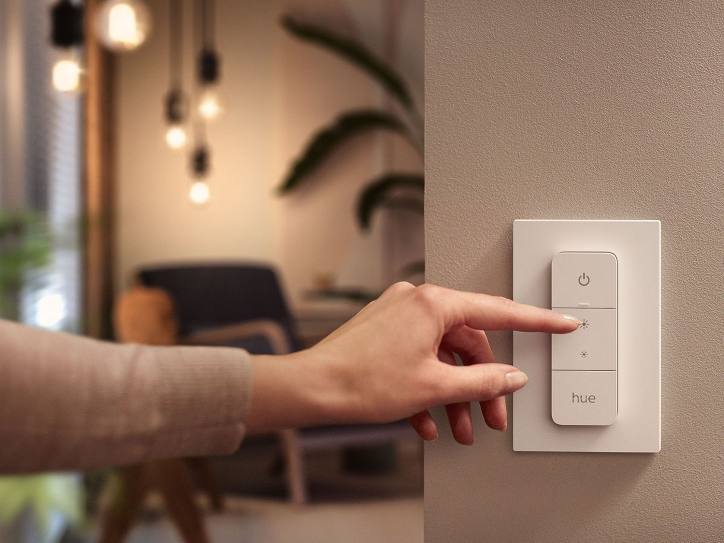 The magnetic dimmer can be attached to the wall plate or detached for use as a remote.