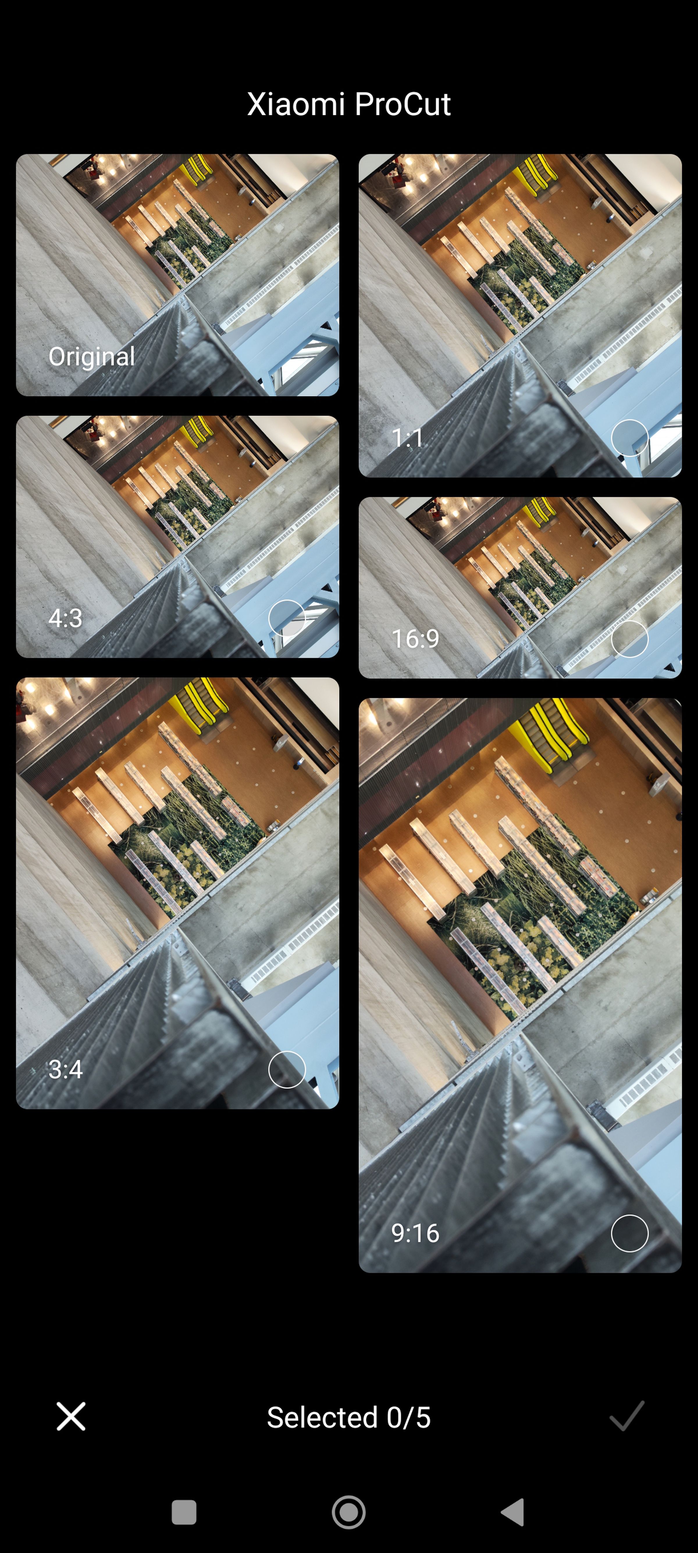 Screenshot of an image taken from the top of an atrium looking downward in multiple image ratio formats.