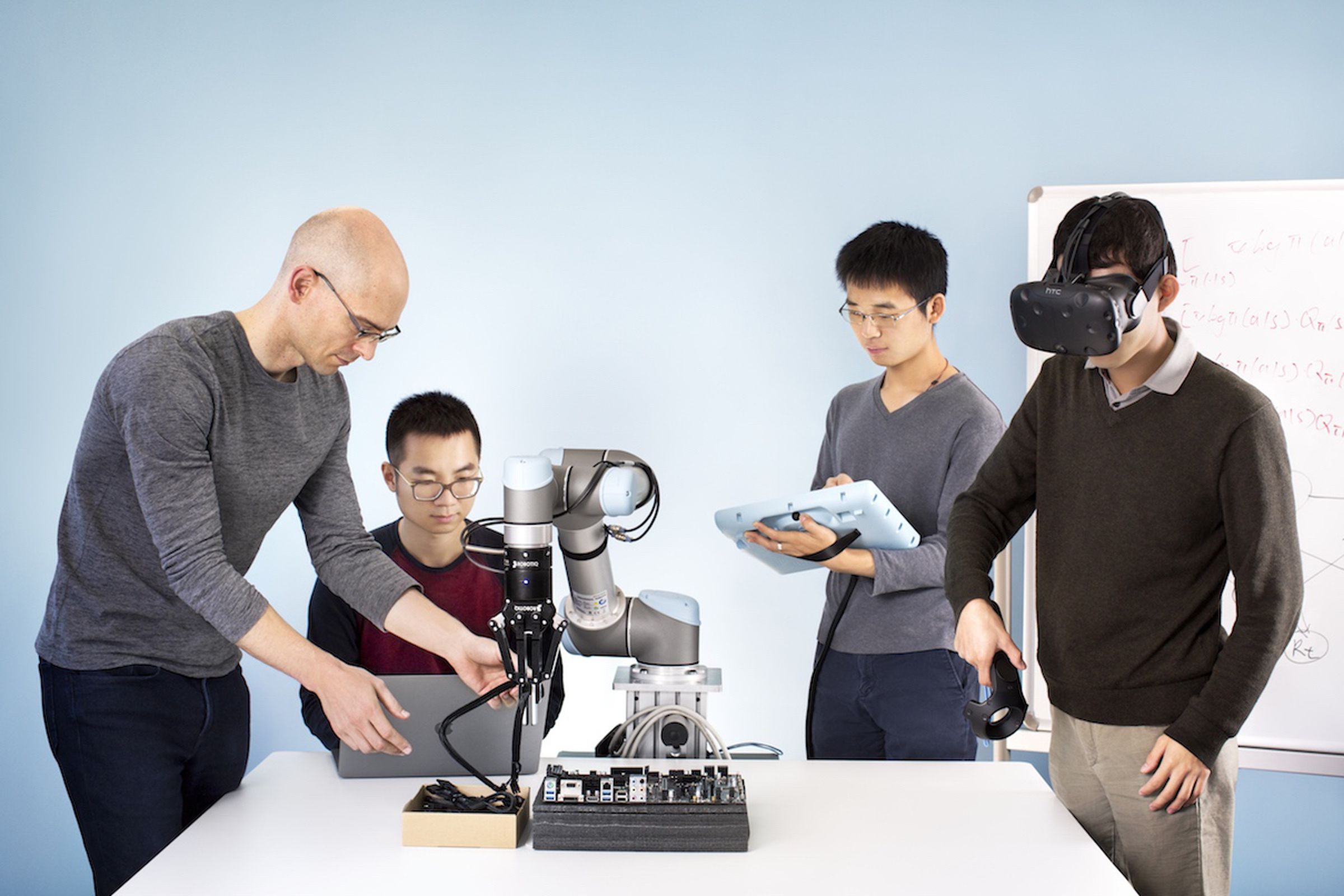 The Embodied Intelligence team, from left to right: Pieter Abbeel (president and chief scientist); Peter Chen (CEO); Rocky Duan, (CTO); and Tianhao Zhang (research scientist).