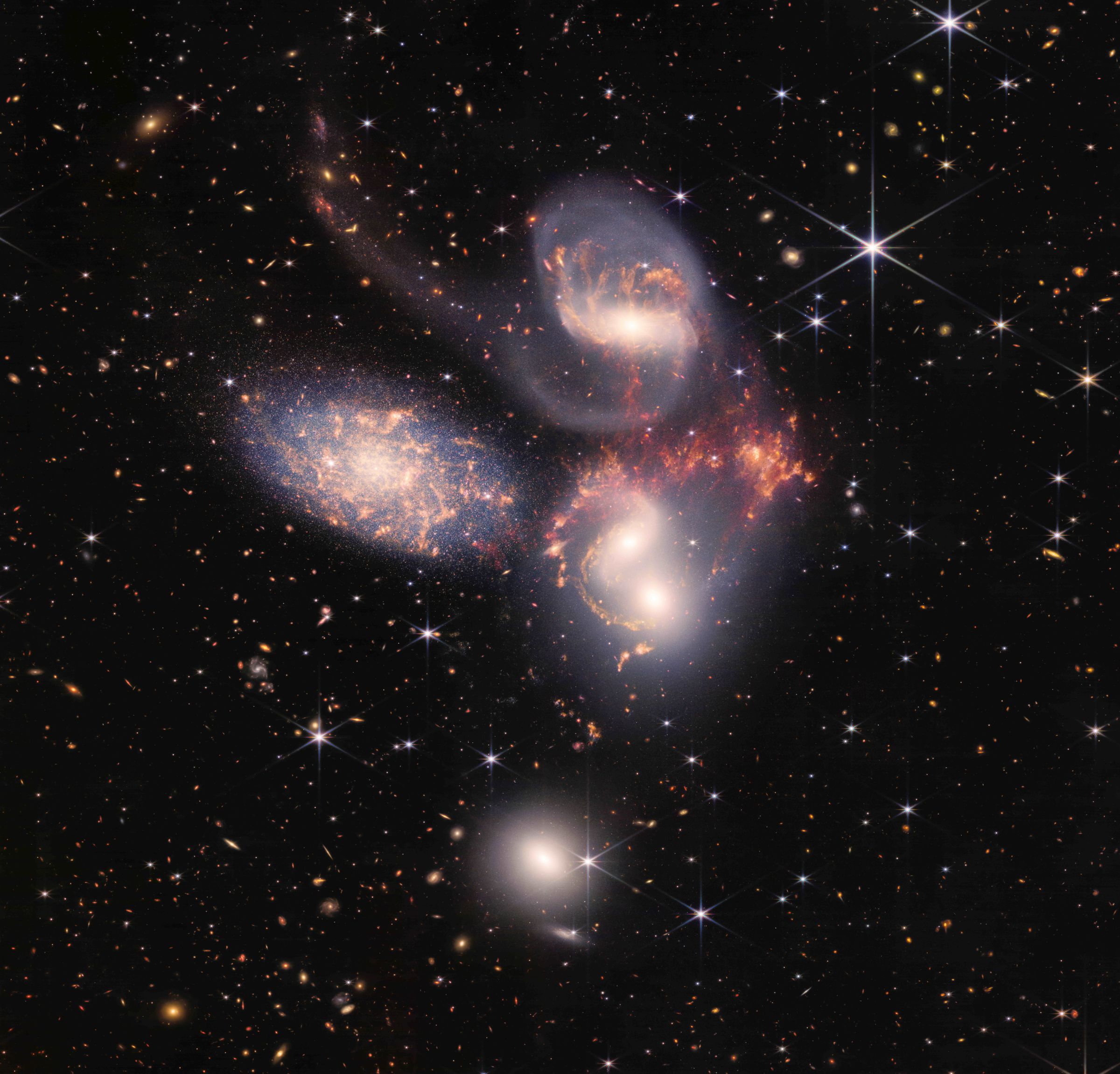 Swirling pink and blue galaxies against a starry backdrop. 