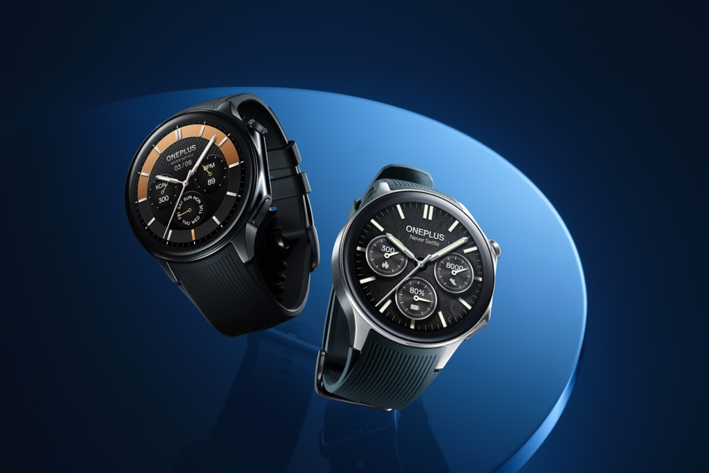 A promotional image showing the black and silver OnePlus Watch 2 against a rendered blue disc on a black background.