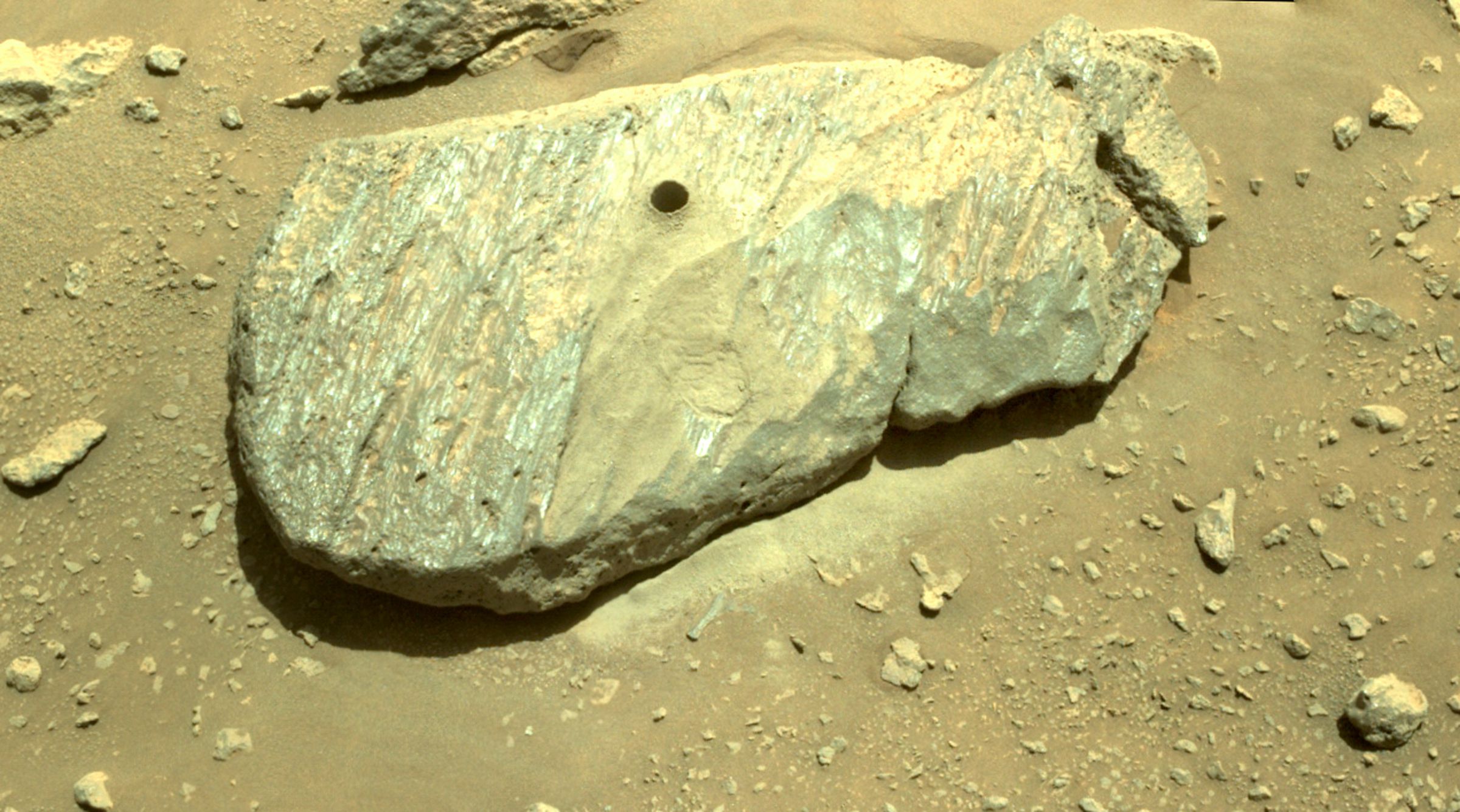 “Rochette,” the rock scientists elected as Perseverance’s drilling target, is left forever with a tiny hole where the rover extracted a rock sample.
