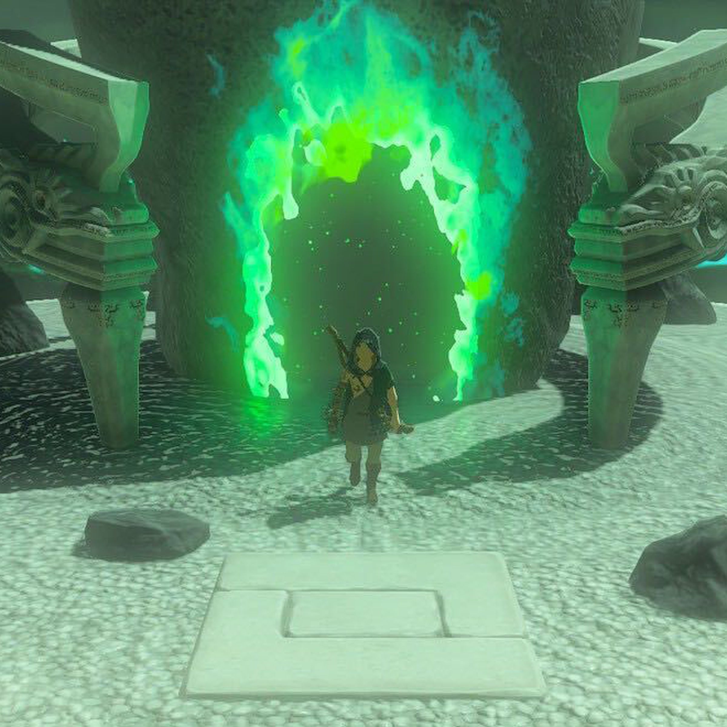 A hooded man stepping out of a glowing hole in the side of an ovular stone. The doorway in the stone is flanked by stone serpent heads, and the ground beneath the man is covered in manicured sand.