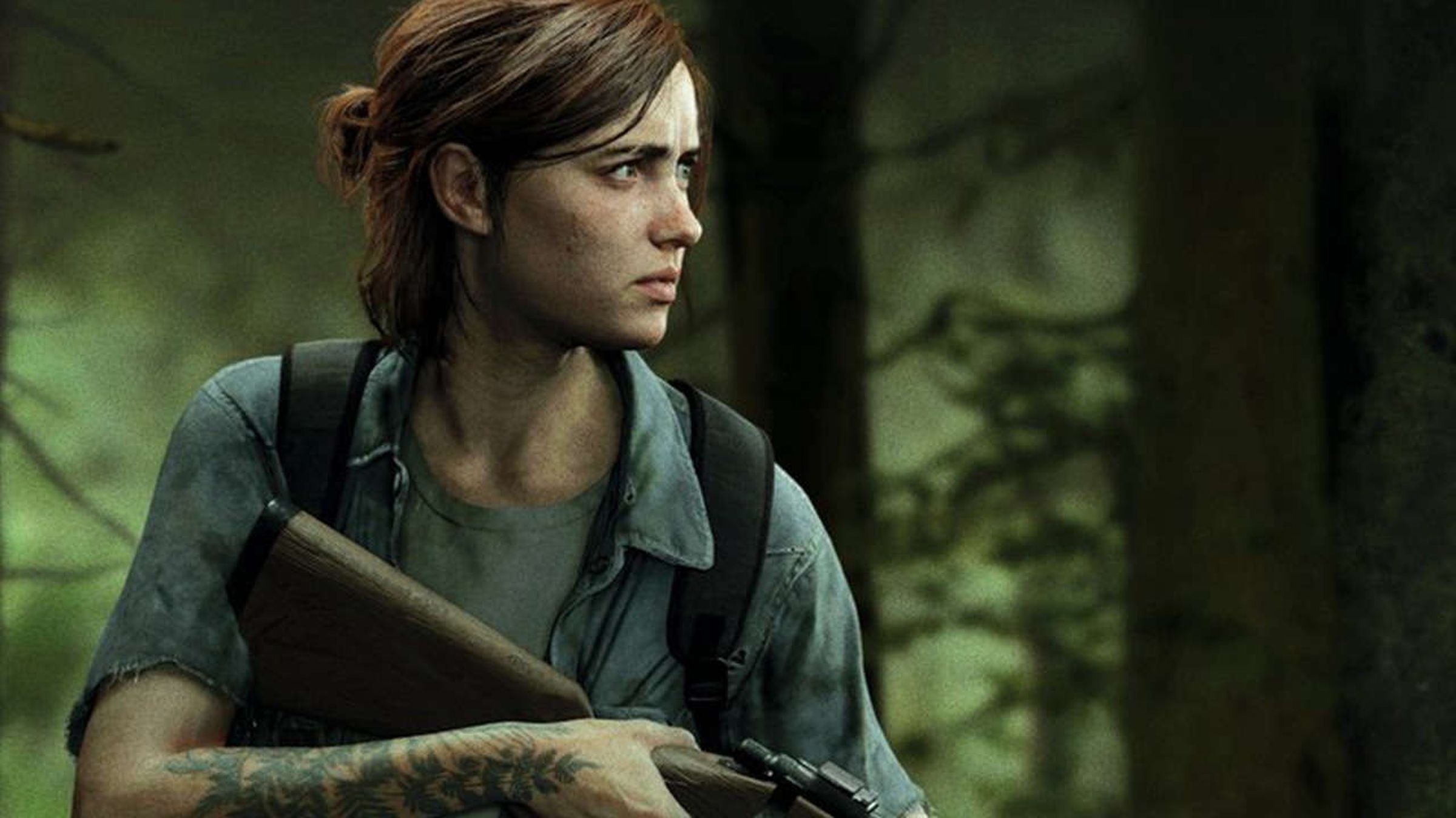 Ellie, a tattoo visible on her arm, holds a gun and watches something in the distance warily.
