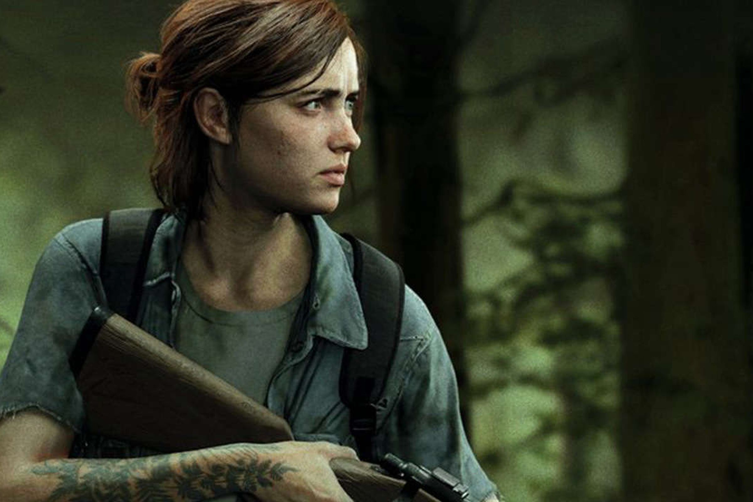 Ellie, a tattoo visible on her arm, holds a gun and watches something in the distance warily.