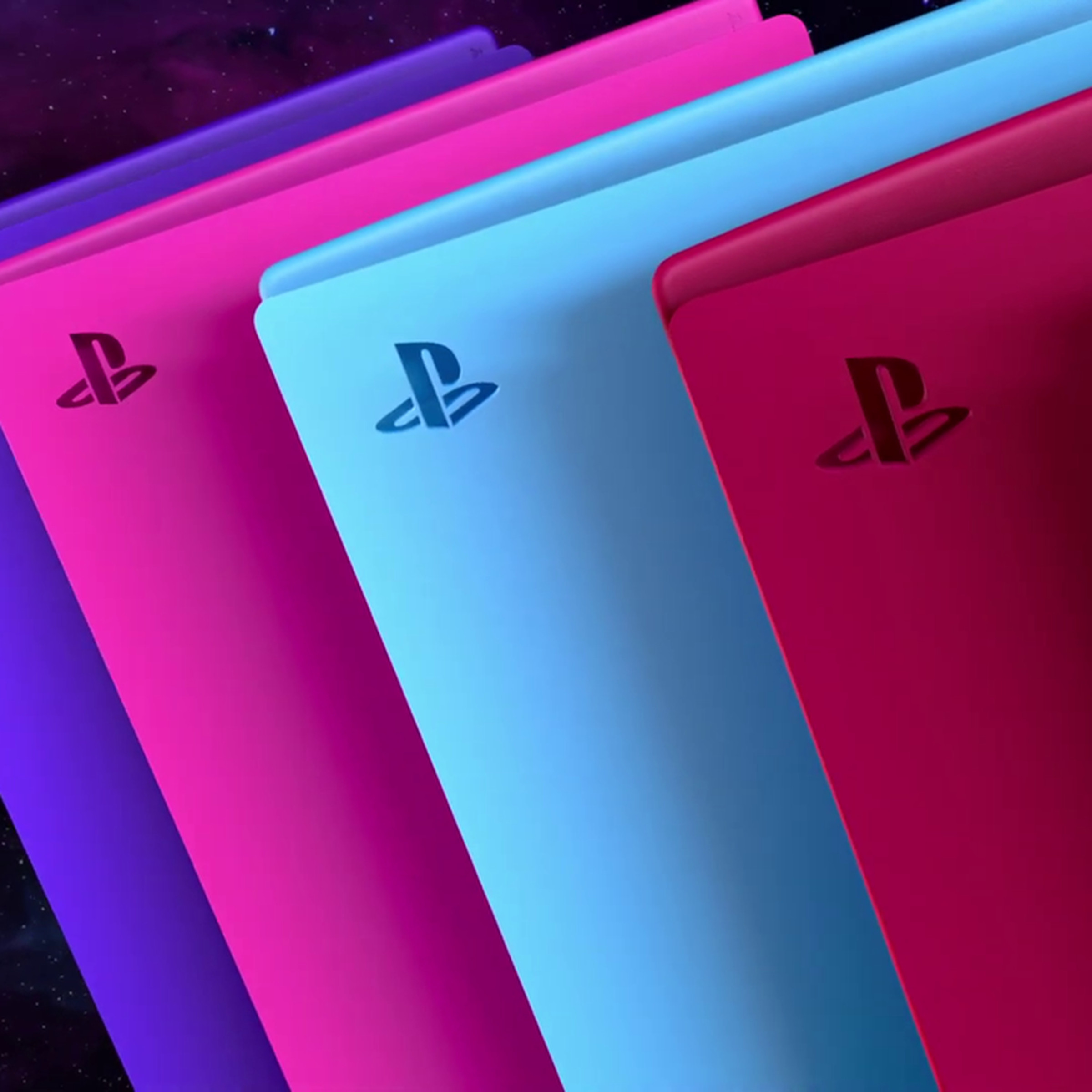A render of the colorful replacement console covers for the PlayStation 5. From left to right: purple, pink, blue, red, and black.