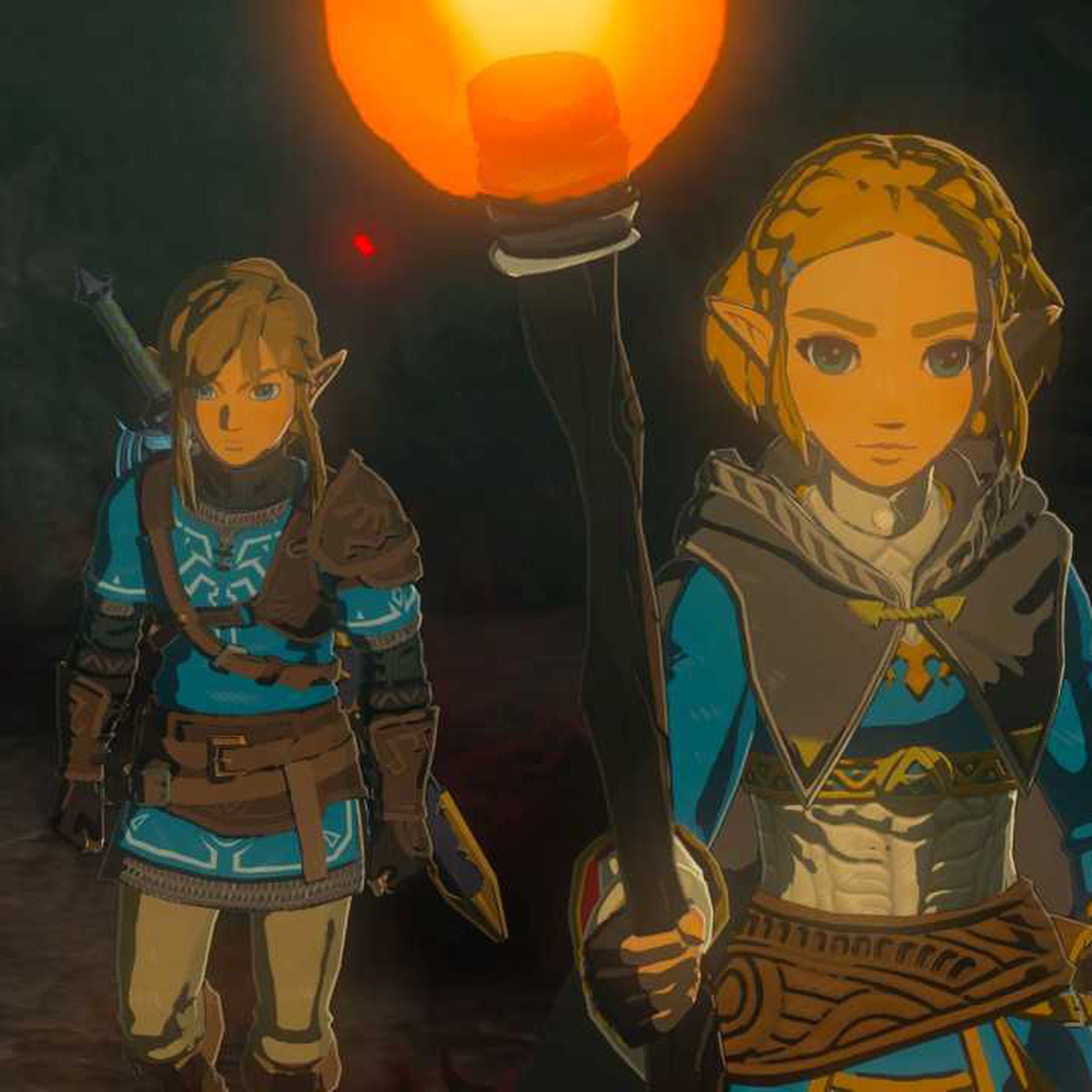 Screenshot from Tears of the Kingdom featuring Link and Zelda exploring a dark, torchlit cave