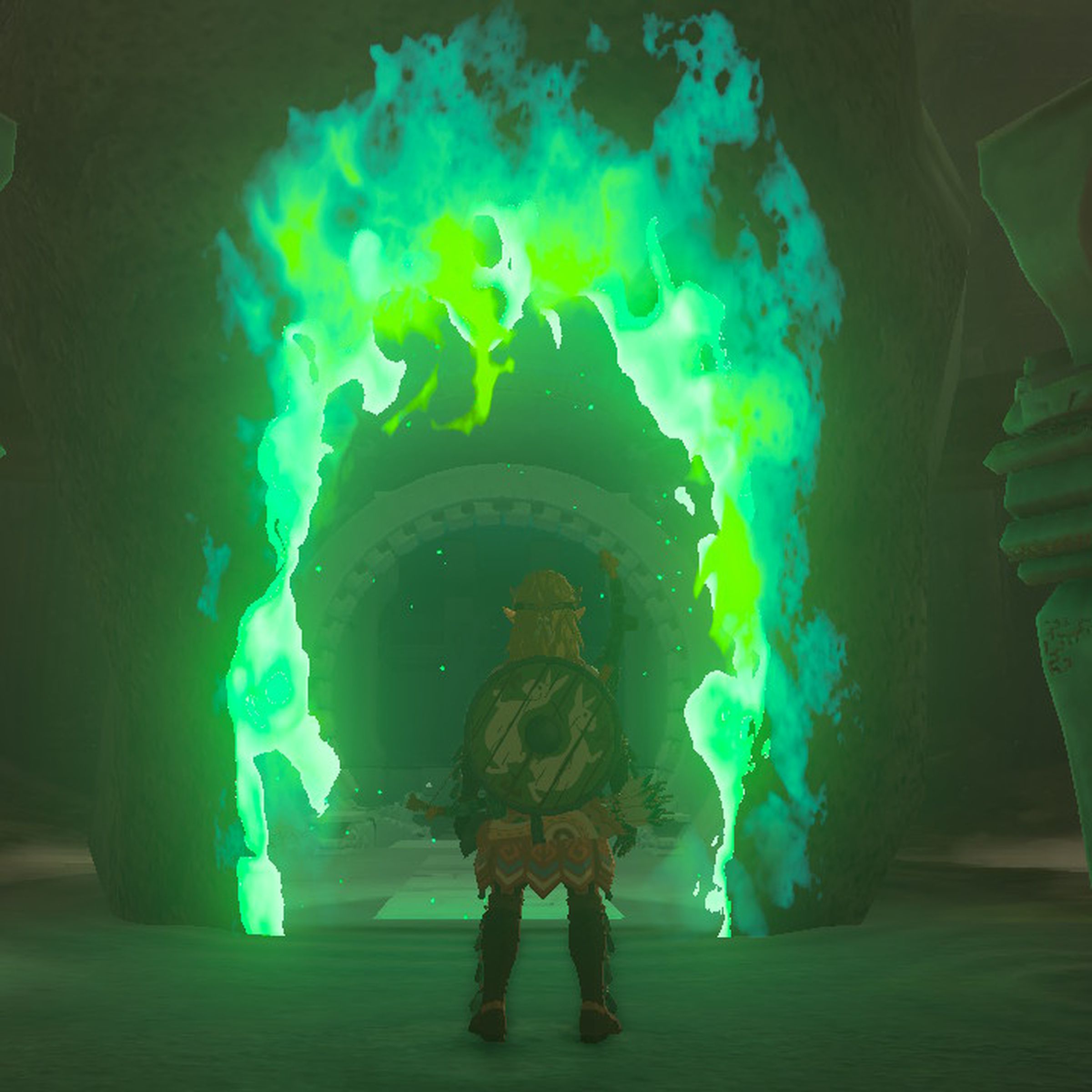 Screenshot from Tears of the Kingdom featuring Link standing at the green glowing entrance of a shrine