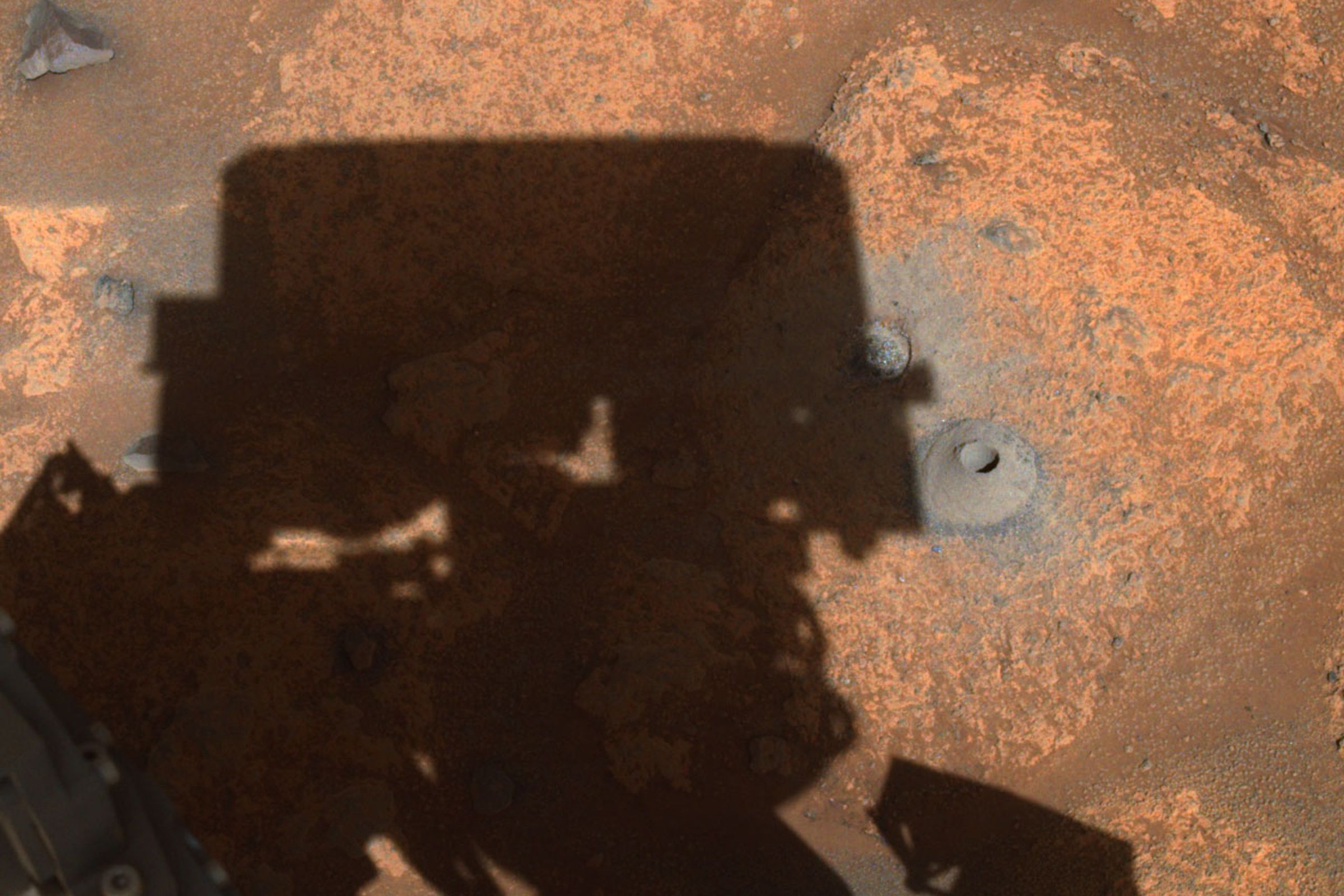 A photo showing the hole drilled during Perseverance’s first sample collection attempt, that left the rover’s sample tube empty.