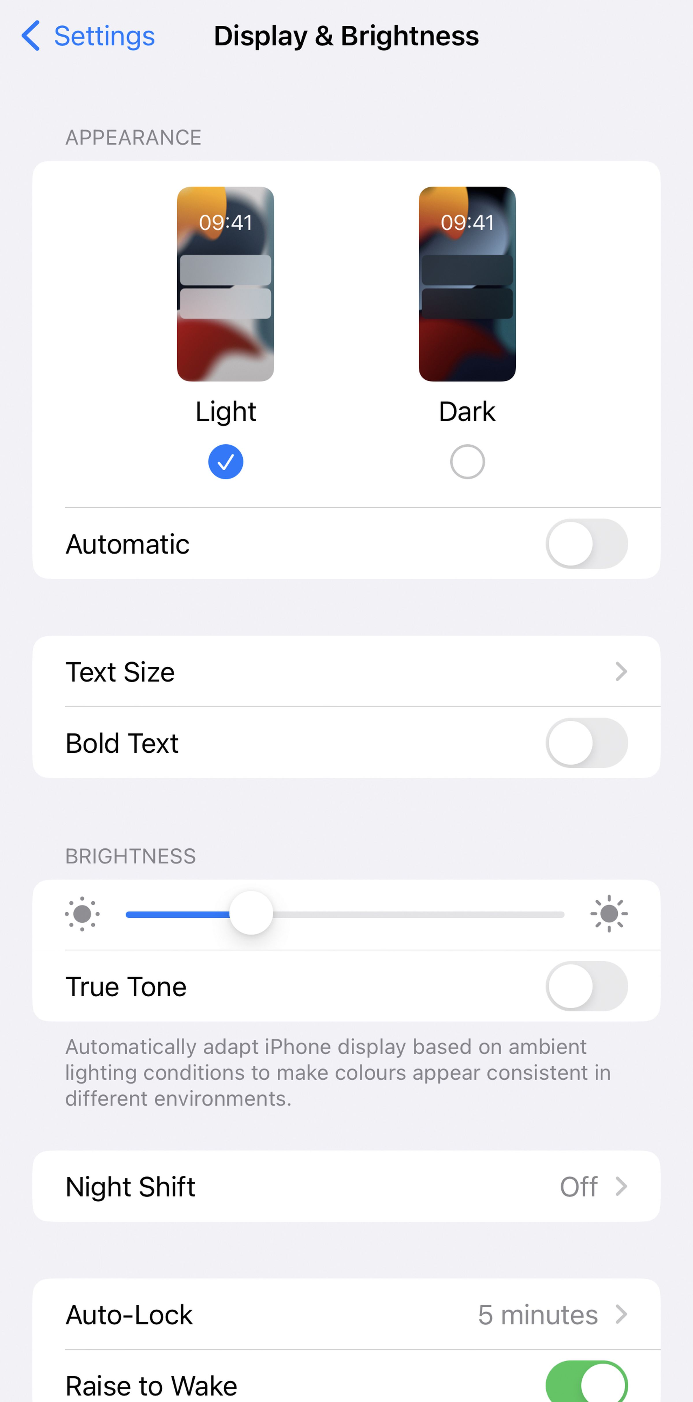 Display &amp; Brightness page with images show a light and dark screen, light chosen, then several other options including text size and bold text.