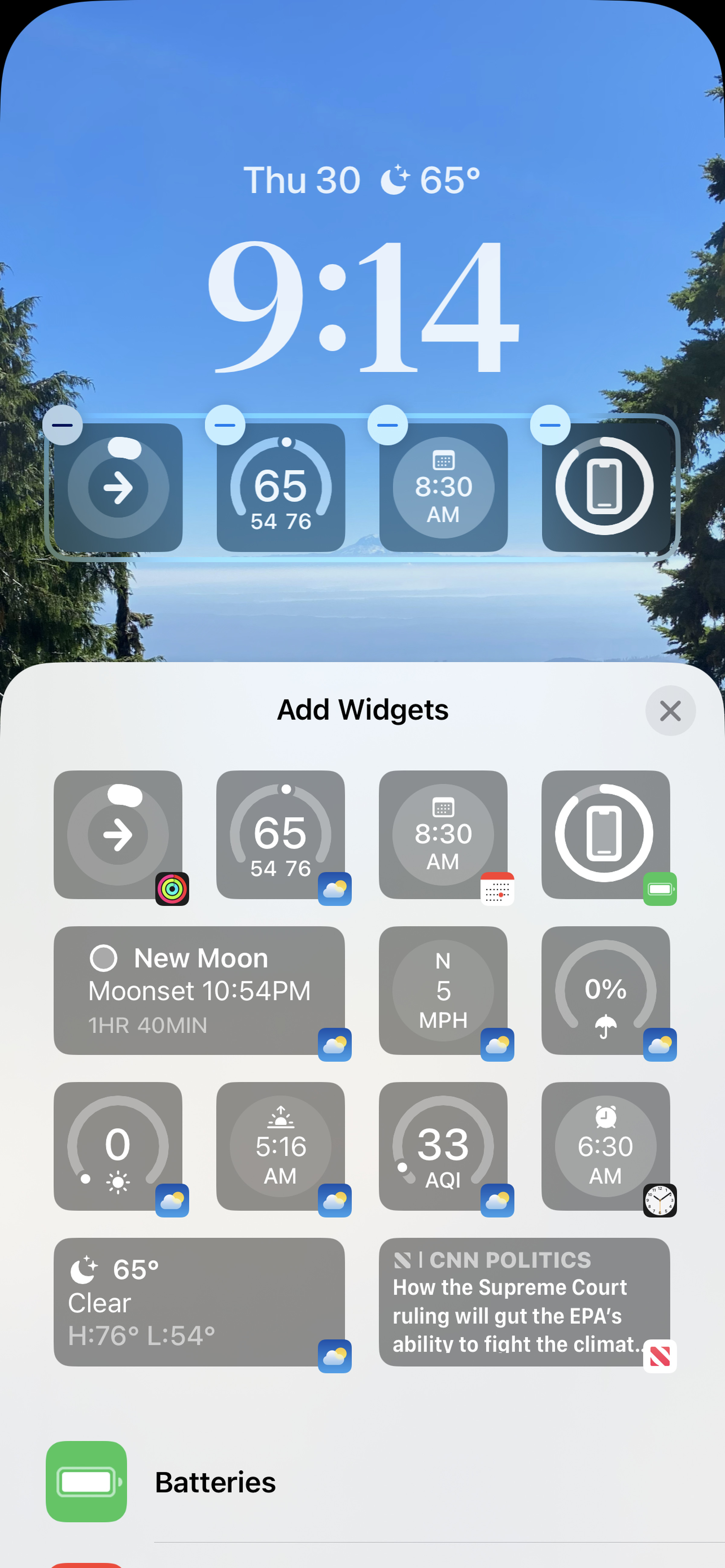 You can add up to four widgets in the shelf below the clock.